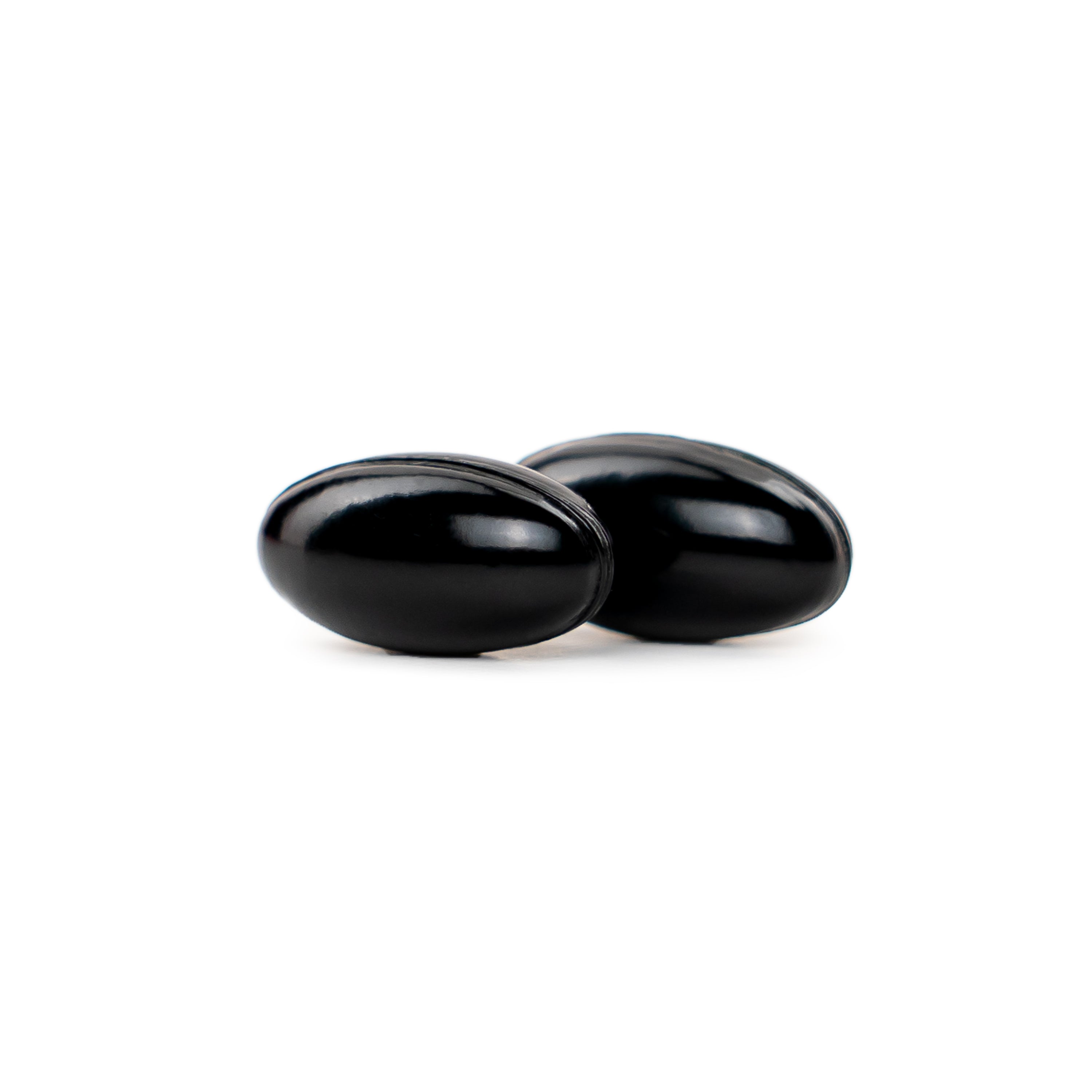 2 Black oval NatureWise Ashwagandha 500m softgels on a white background