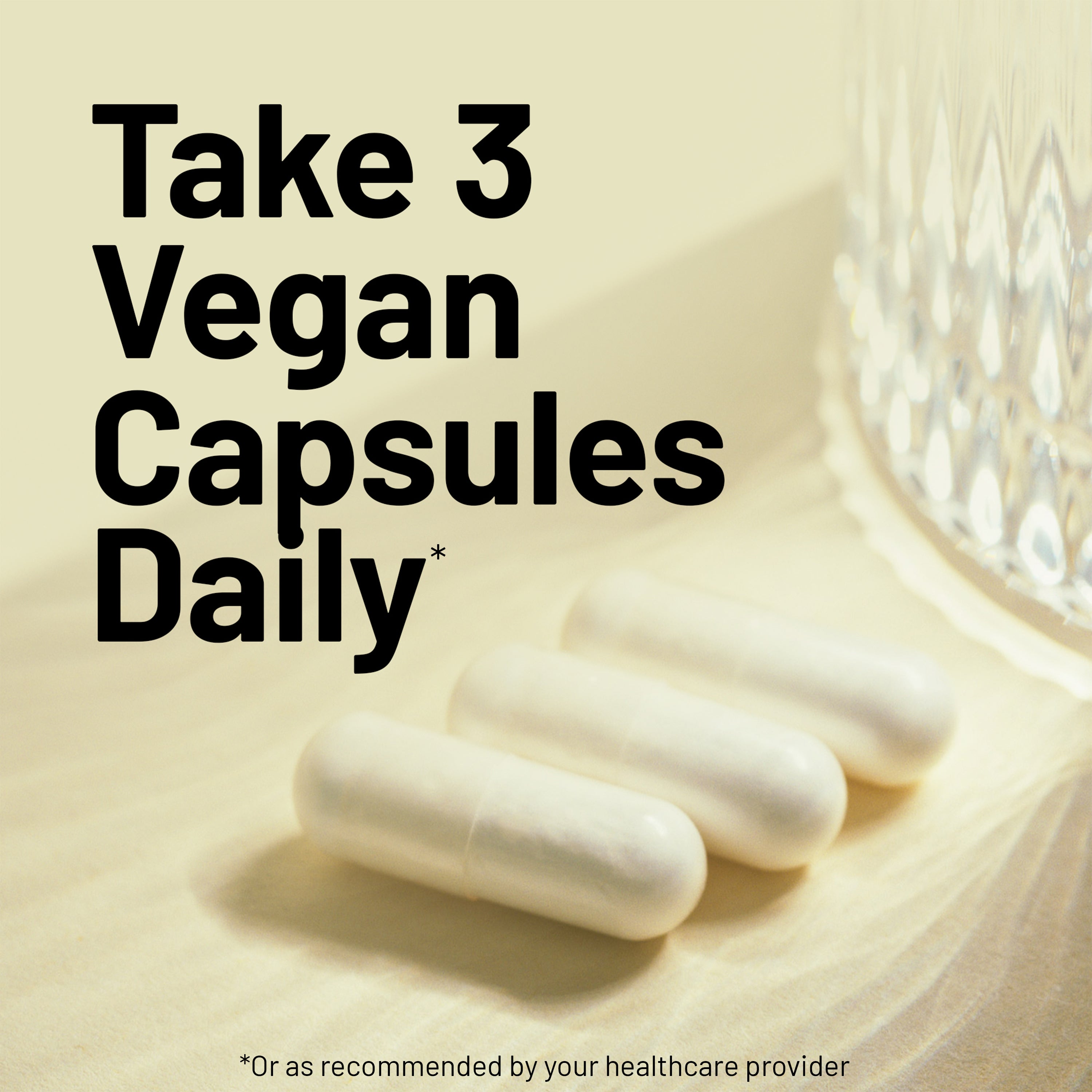 Three white vegan capsules on a light surface with text about daily consumption.