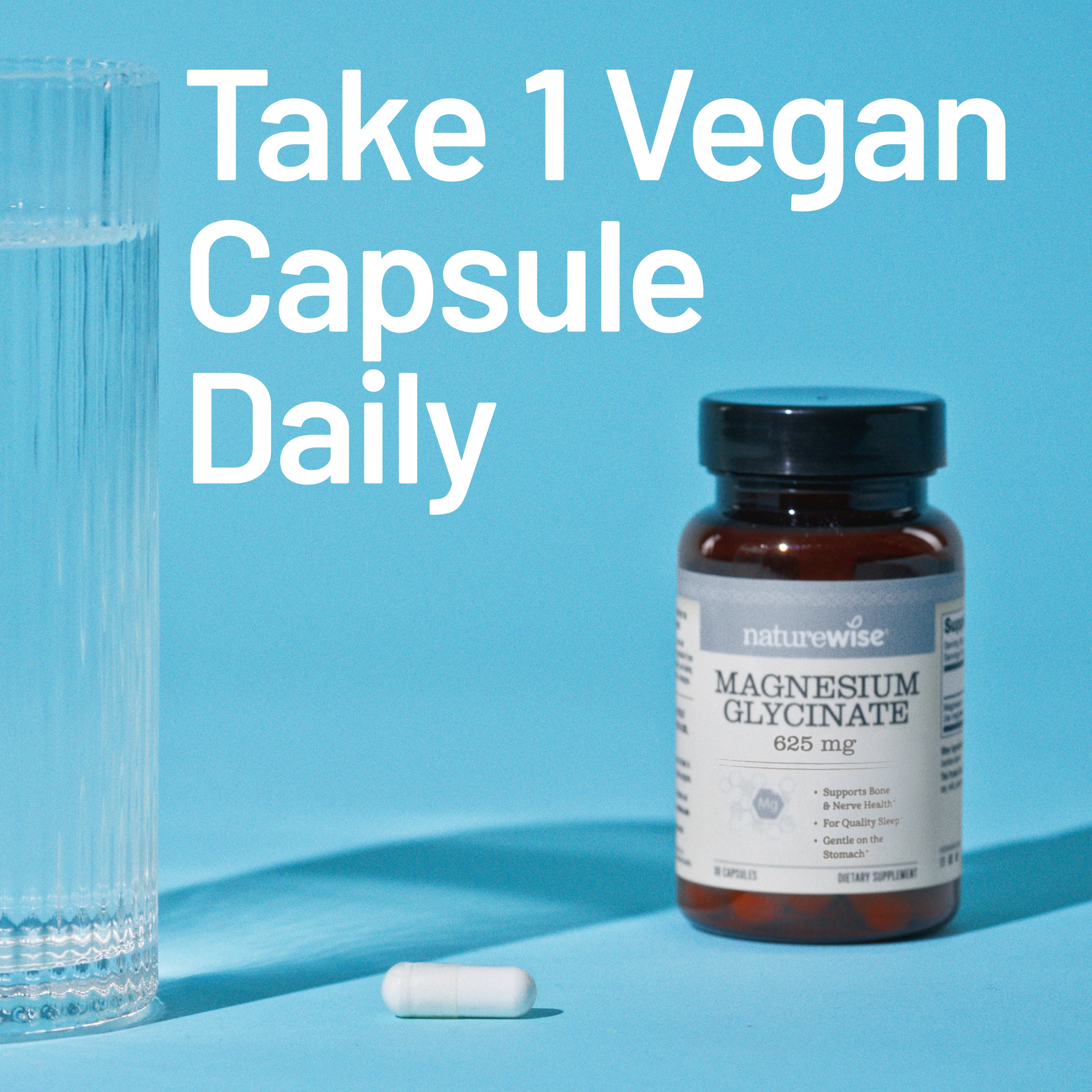Vegan capsule bottle with a glass on a blue background