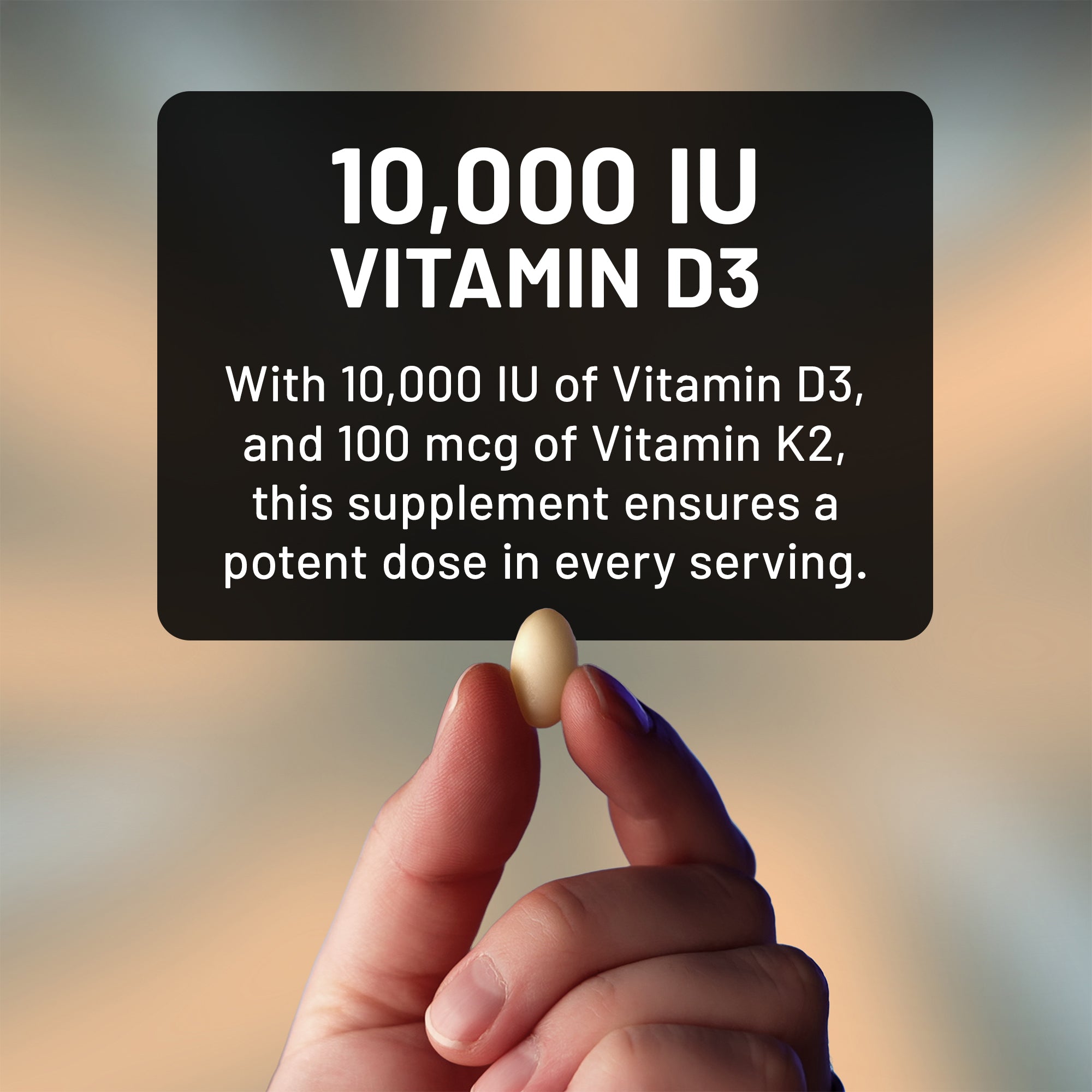 Hand holding a magnesium supplement softgel with text about Vitamin D3 and K2 on a blurred background