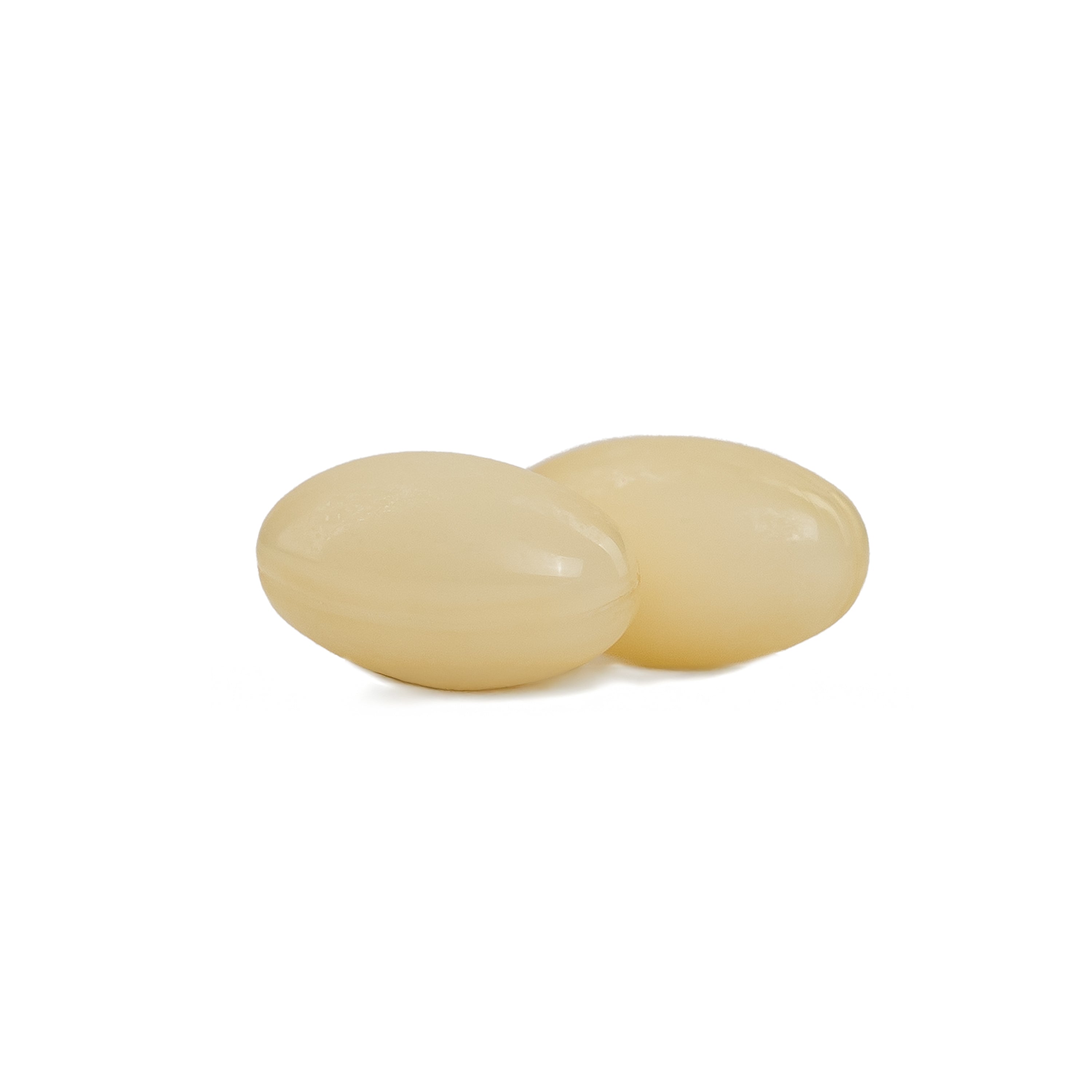 Two beige magnesium glycinate softgels objects on a white background