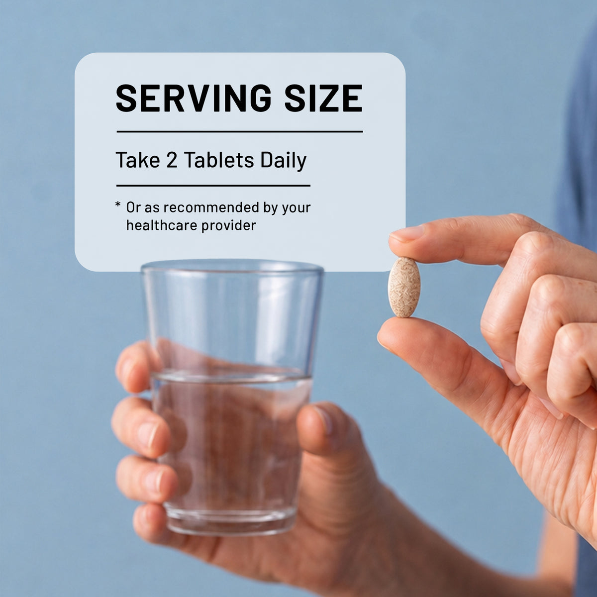 A hand holds a single beige tablet between fingers while another hand holds a clear glass of water. A light gray label overlay reads 'SERVING SIZE' with text 'Take 2 Tablets Daily' and a small asterisk note.
