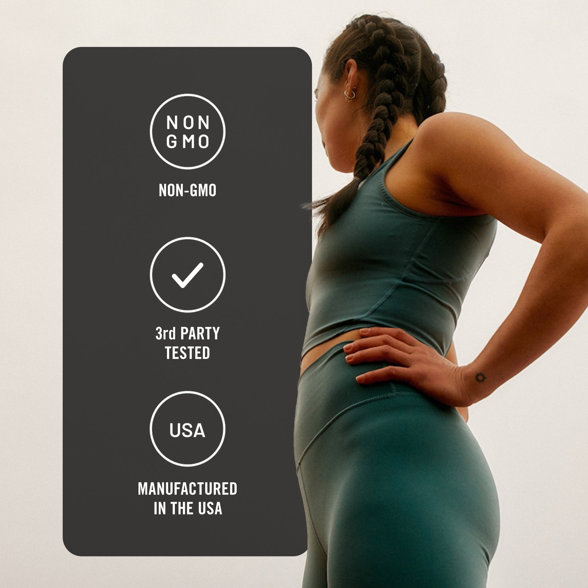 Woman in green athletic wear with certification labels on a gray background