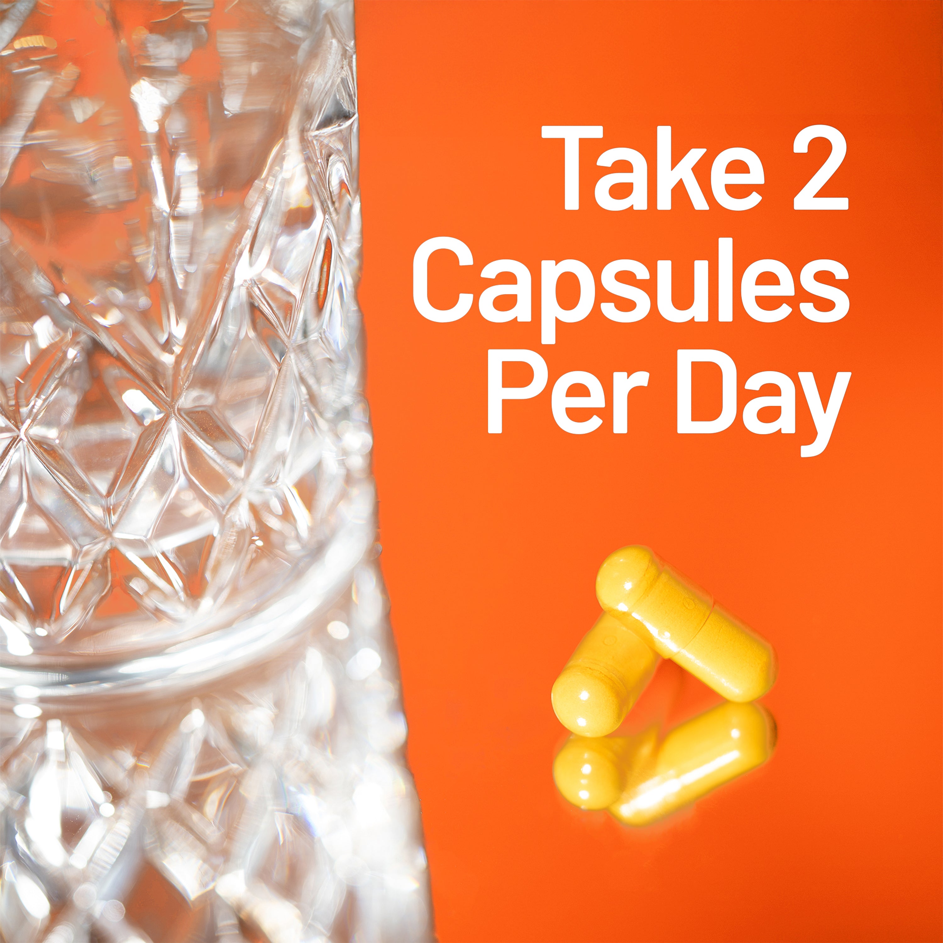 Clear glass container with yellow capsules on an orange background with text 'Take 2 Capsules Per Day'.