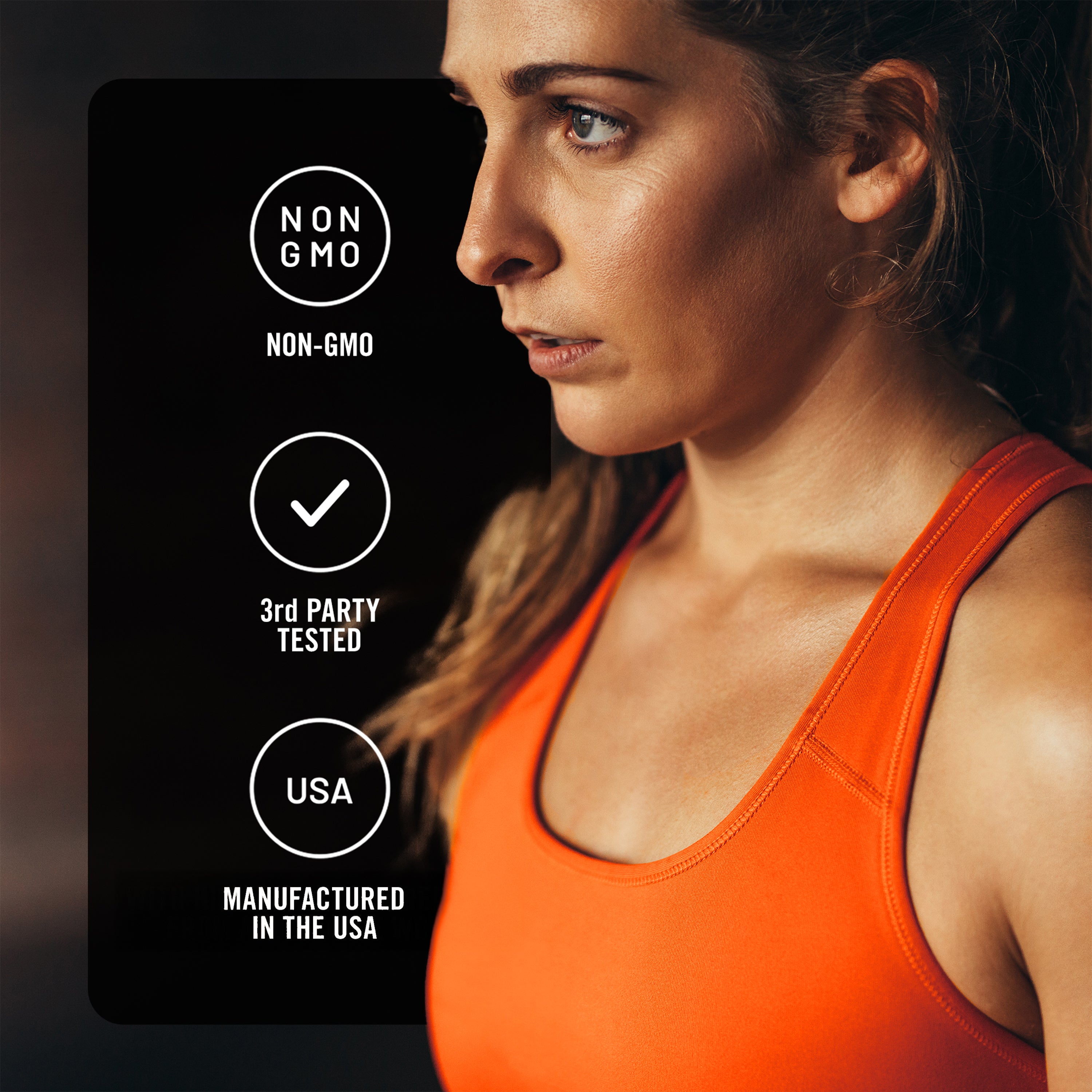 Woman wearing an orange tank top with certification labels on a dark background
