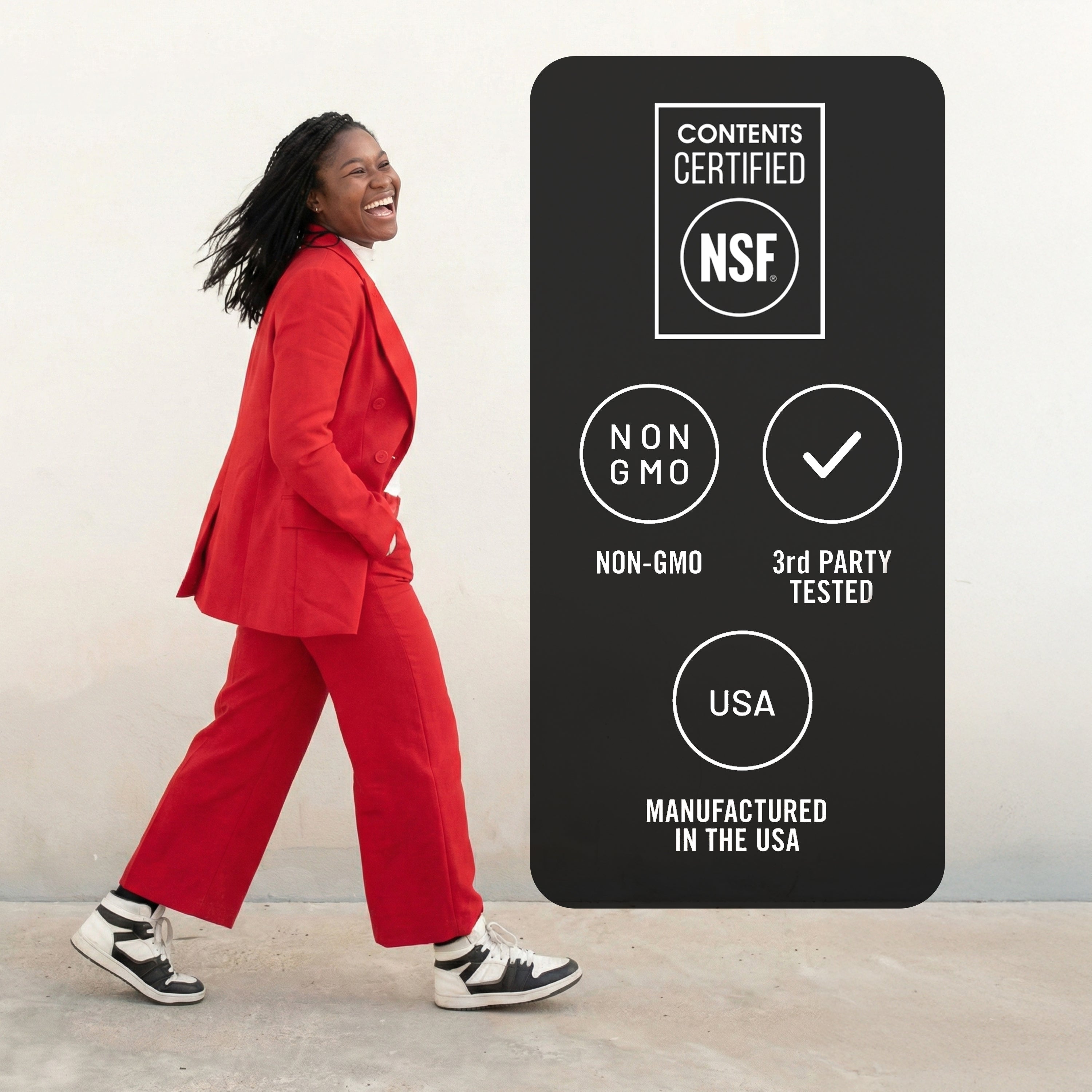 Person in a red suit standing next to a certification label on a white background