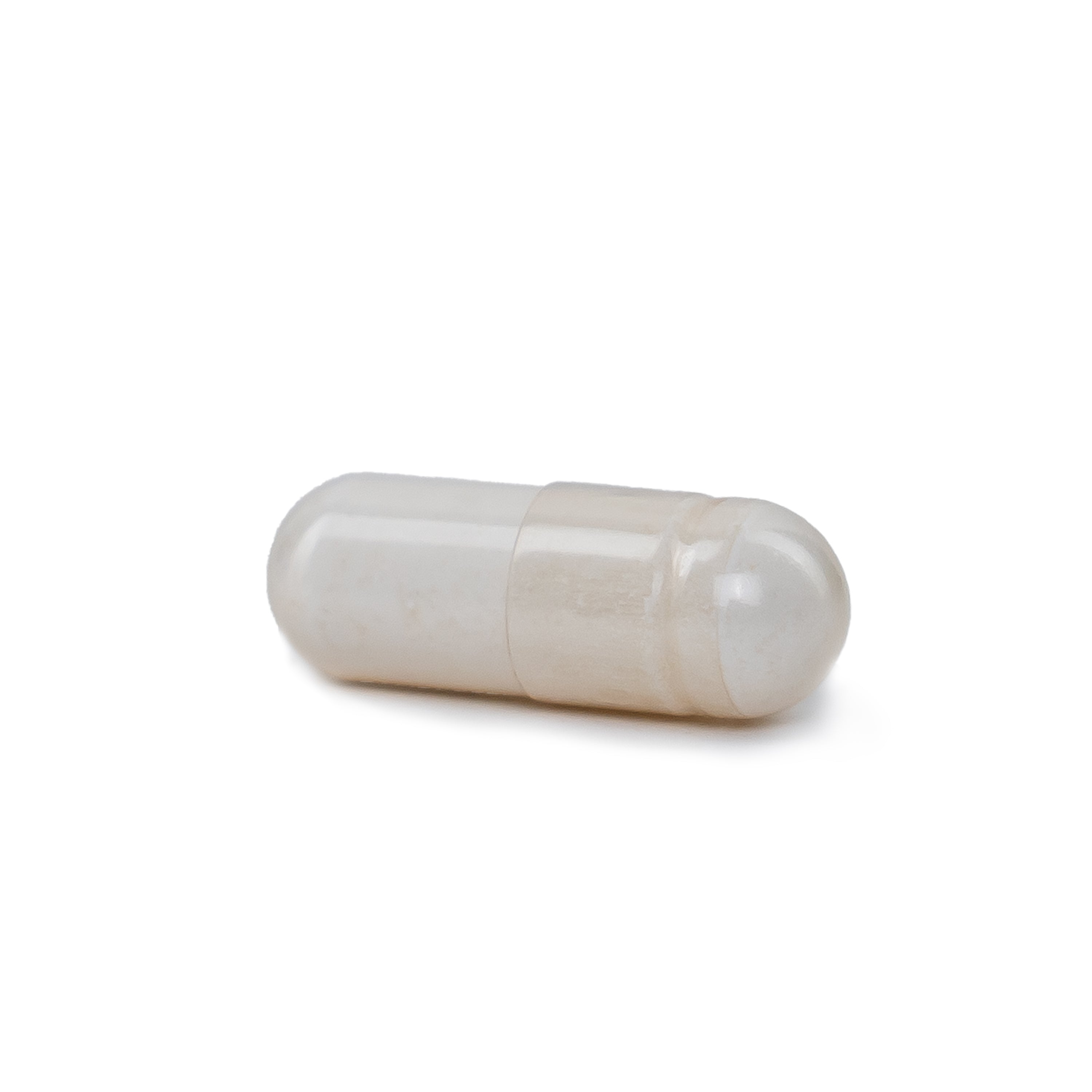 White zinc supplement capsule pill on a white background
