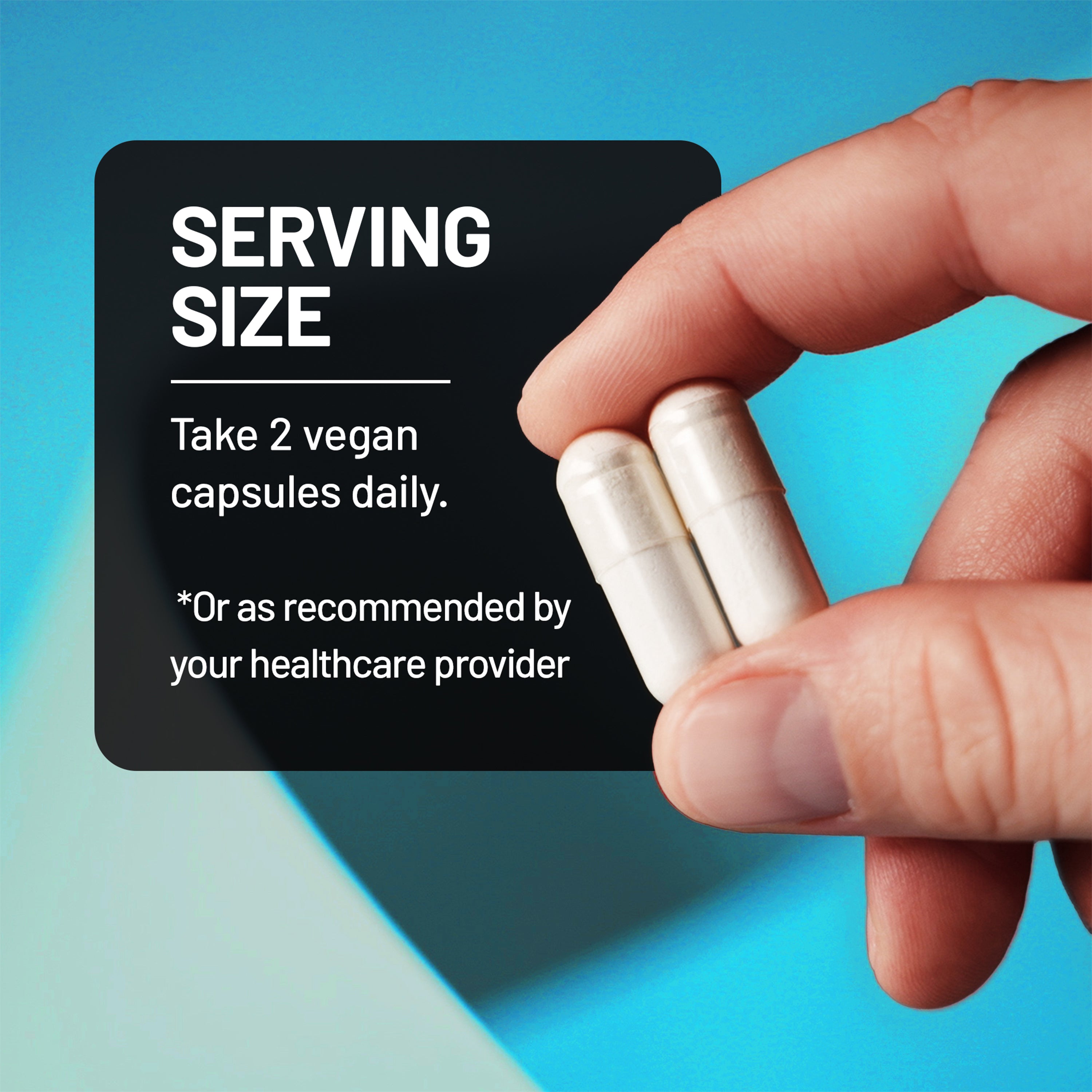 Hand holding two vegan Algae Calcium capsules with serving size information on a blue background
