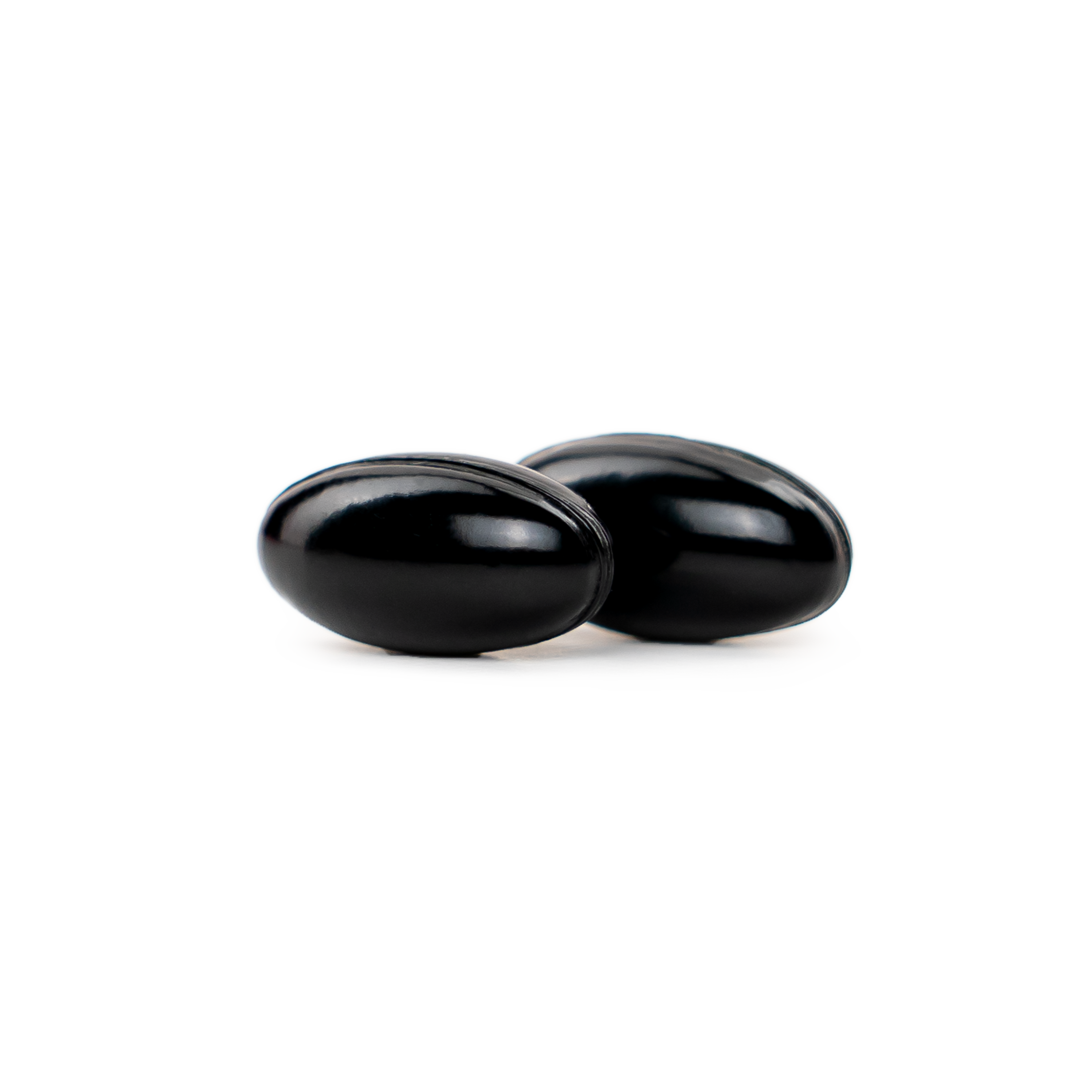 2 black NatureWise Ashwagandha softgels on a blank background