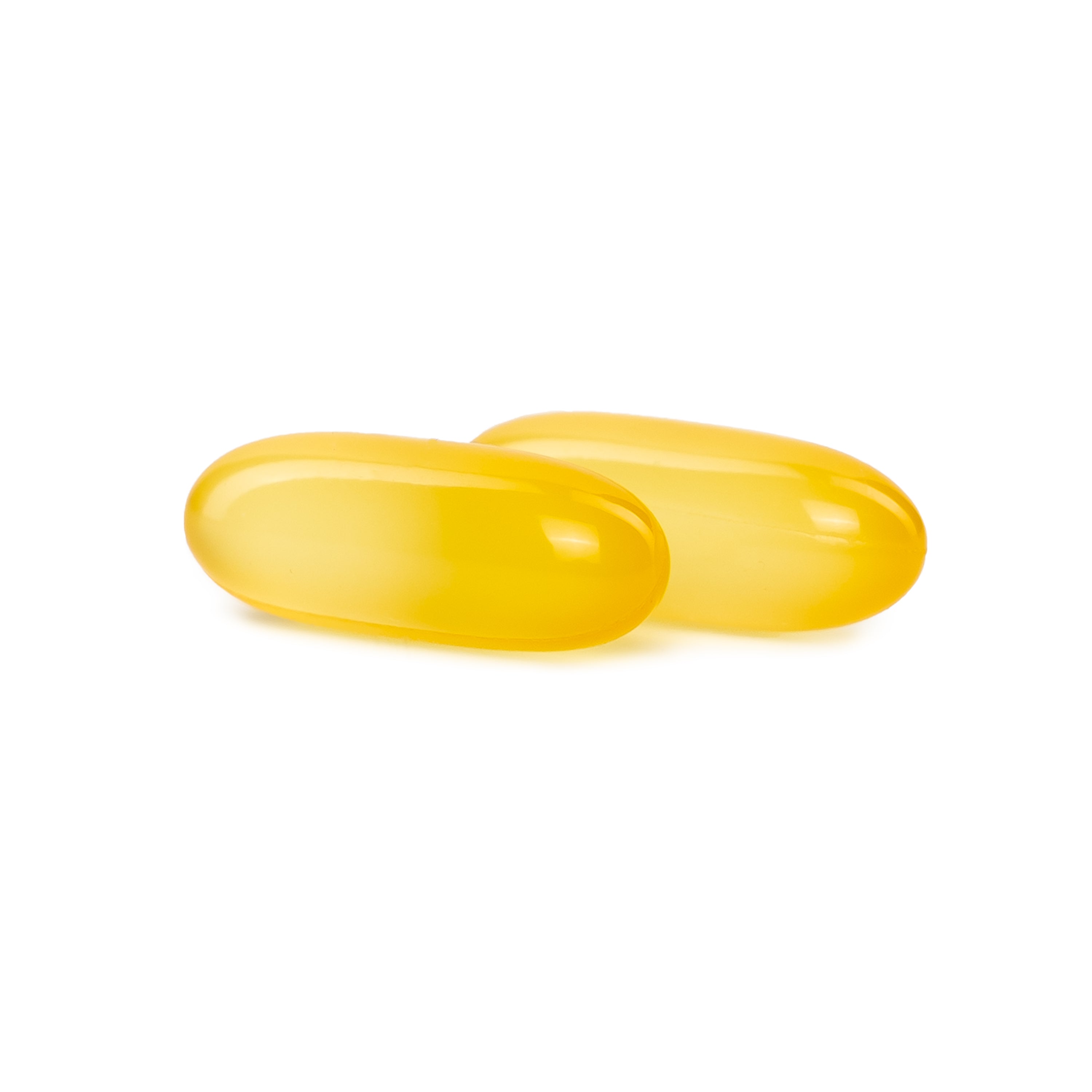Two translucent yellow softgel capsules on a clean white background.