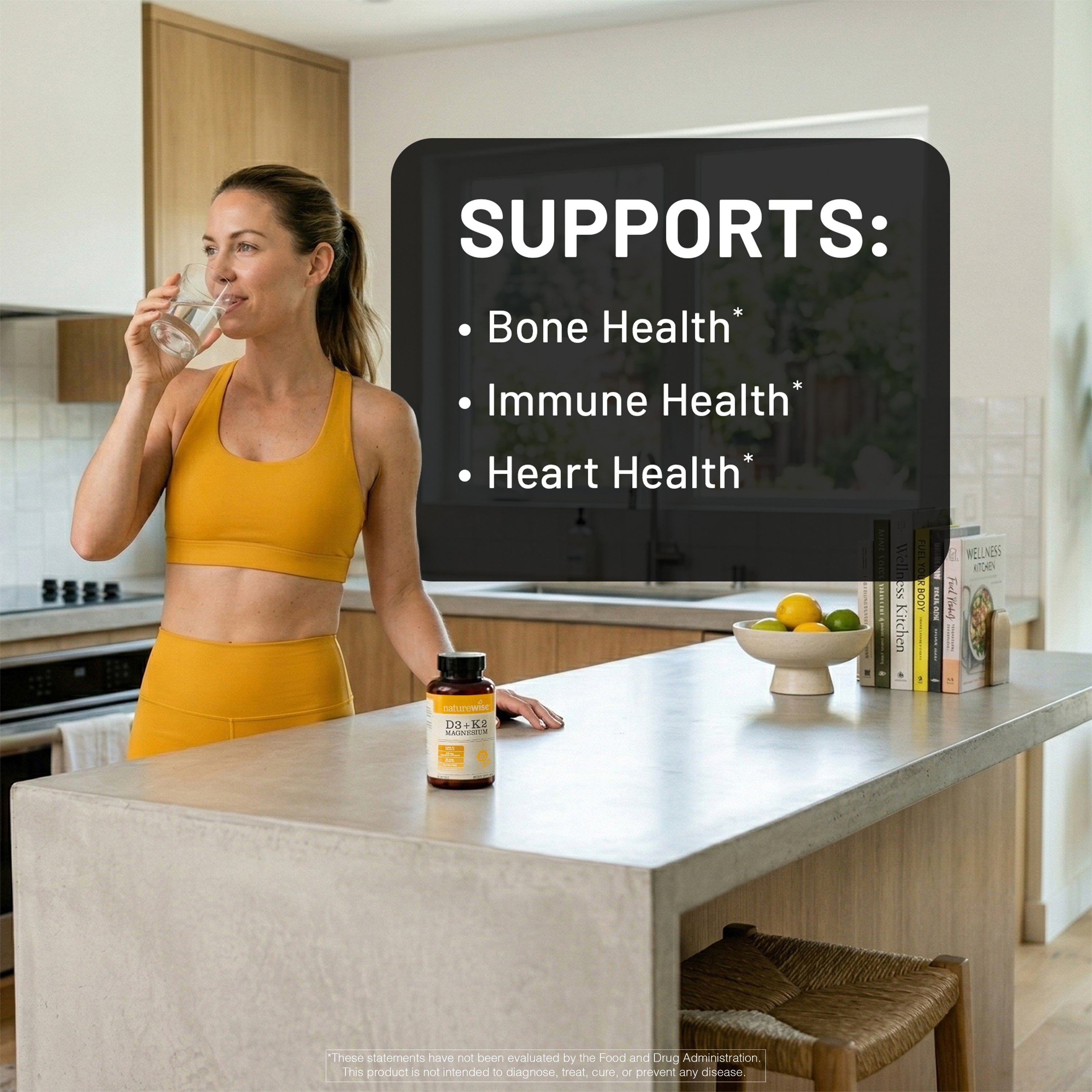 Woman in a kitchen holding a bottle of NatureWise Vitamin D3 K2 with Magnesium supplement with text about health benefits.