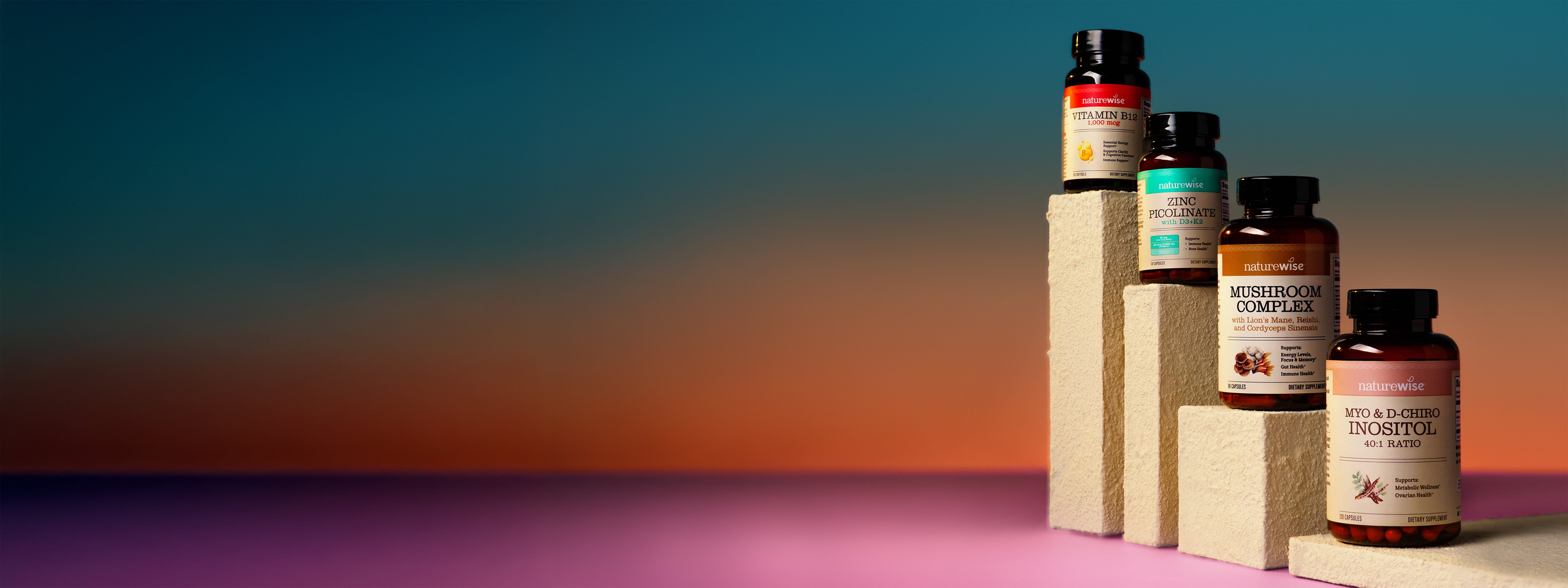 Collection of NatureWise supplement bottles on a gradient background
