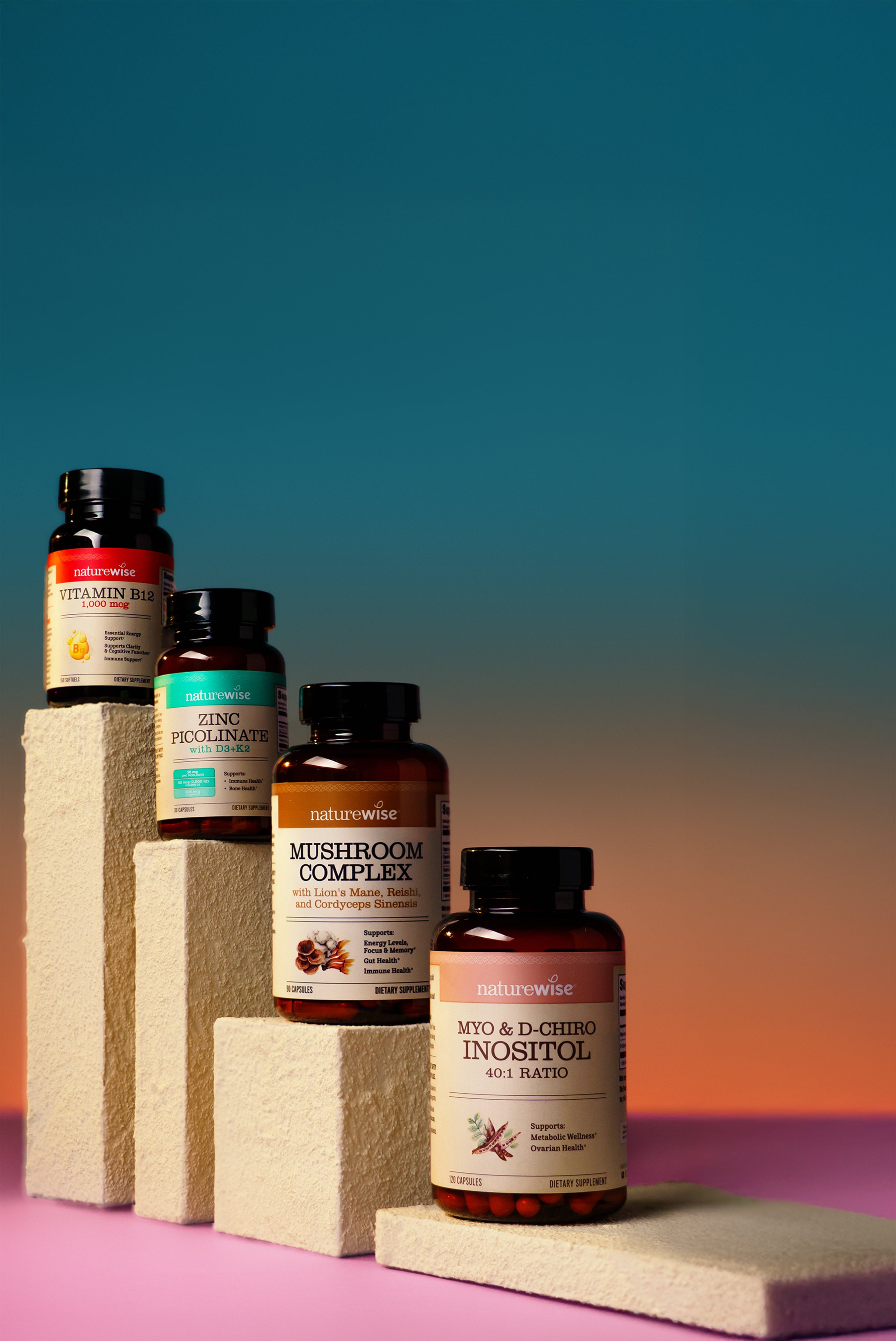 Collection of NatureWise supplement bottles on a gradient background
