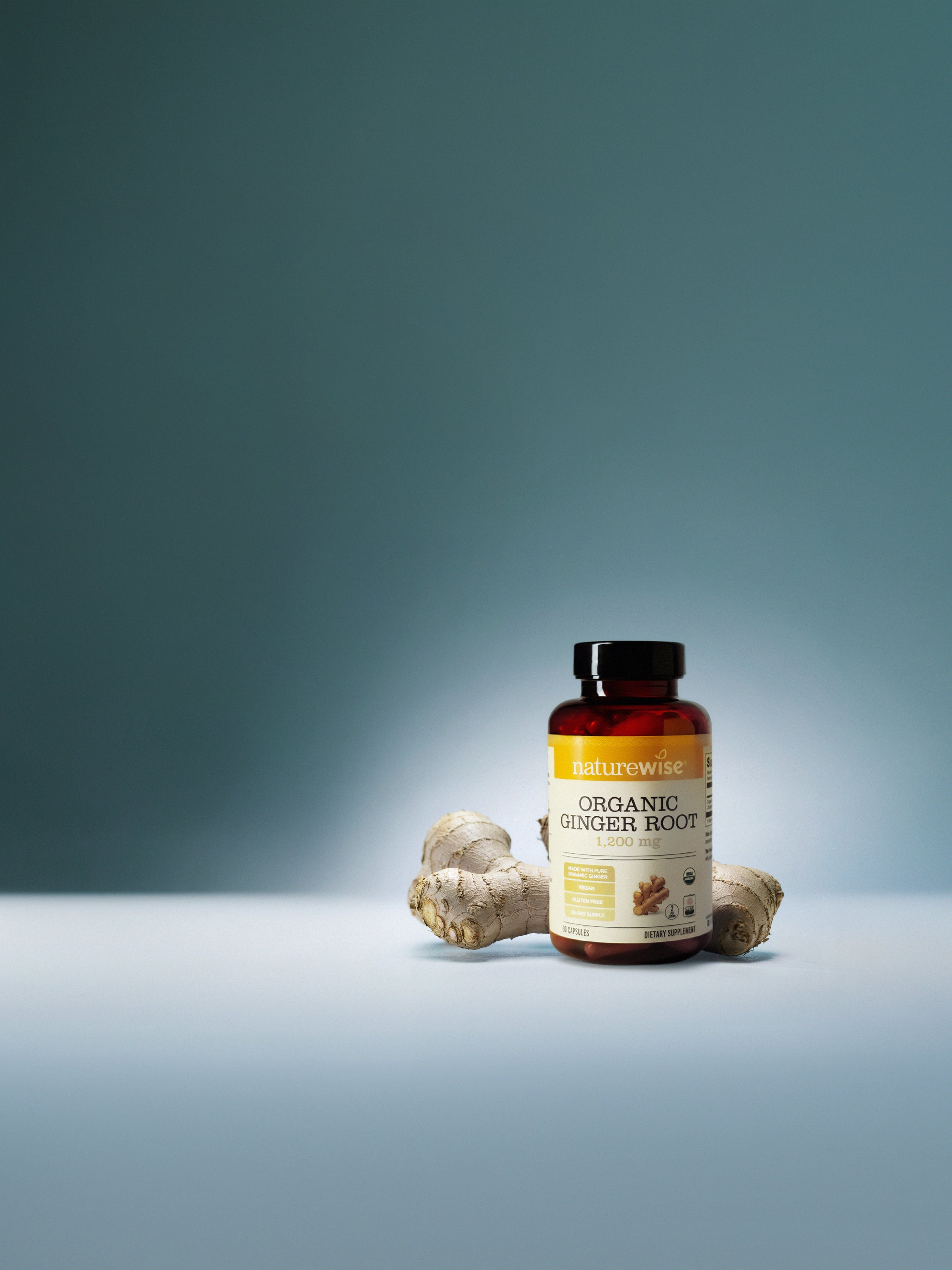 Bottle of Naturewise Organic Ginger Root on a gradient blue background