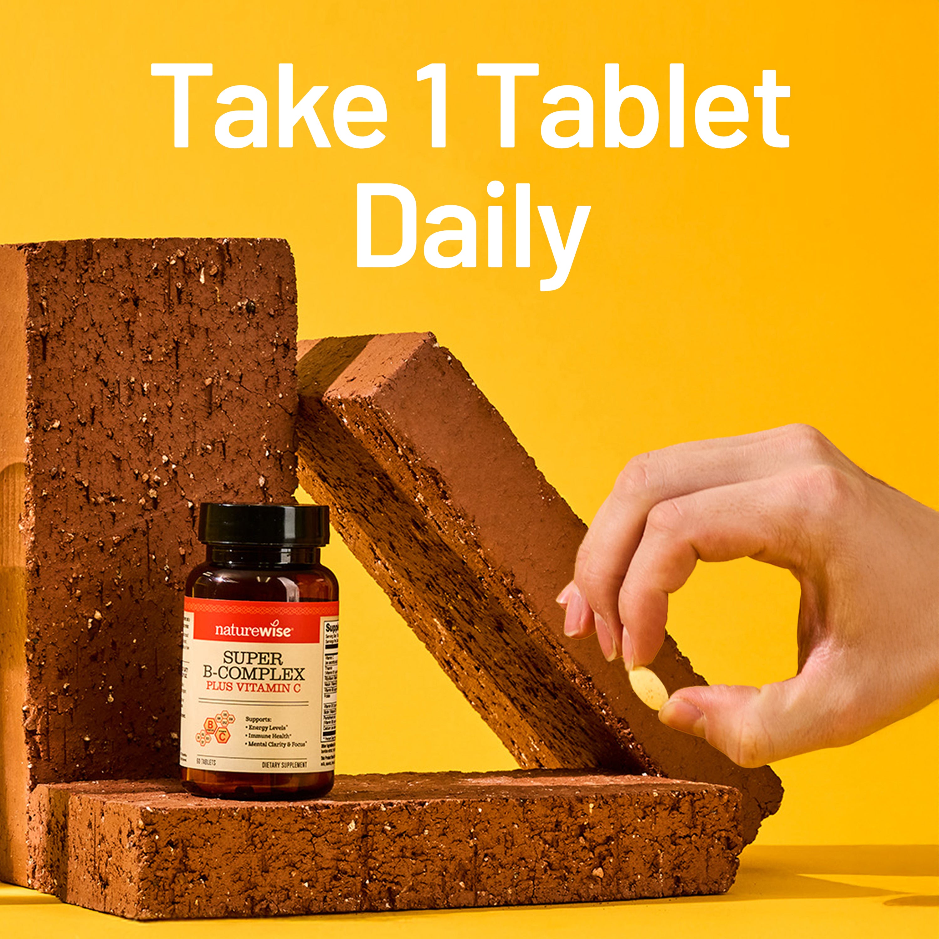 Naturewise Super B complex vitamin bottle with a tablet on a yellow background