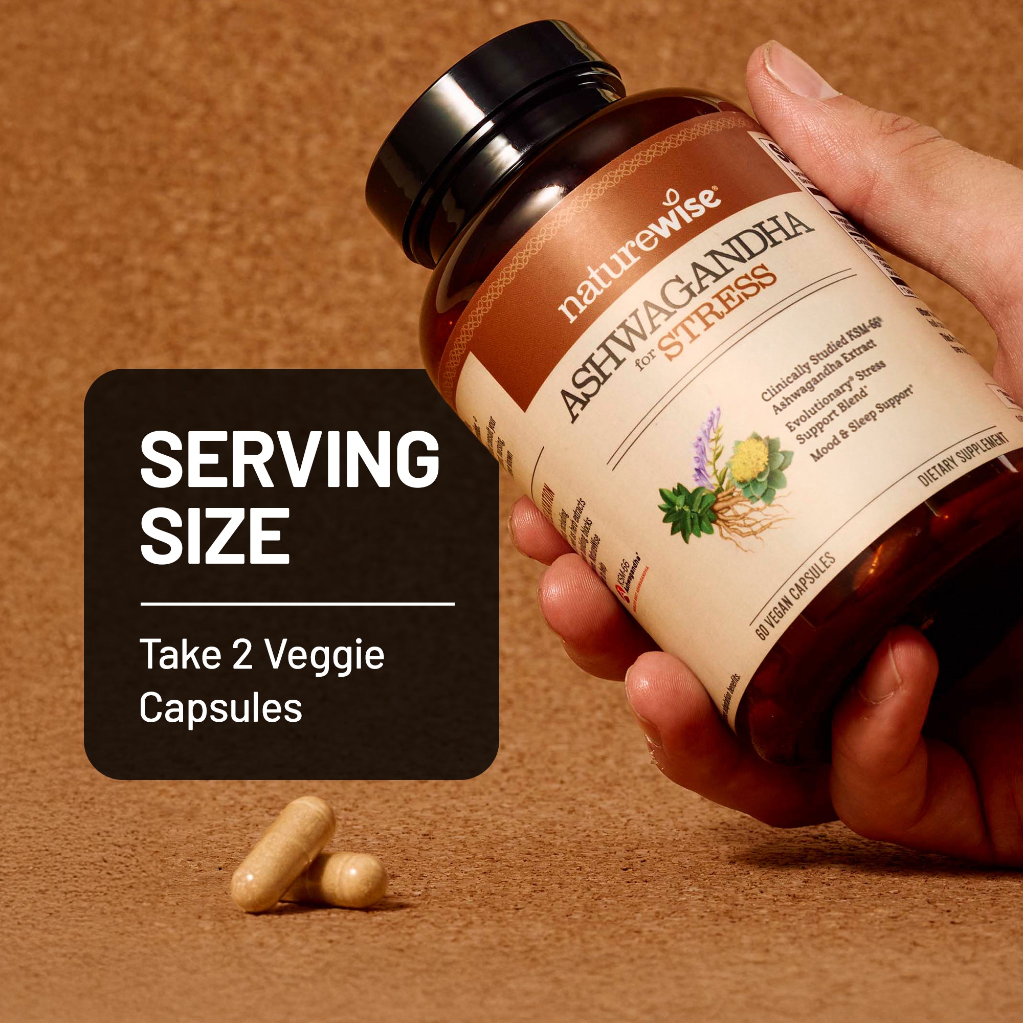 Hand holding a bottle of NatureWise Ashwagandha for Stress supplement with serving size information on a brown background.