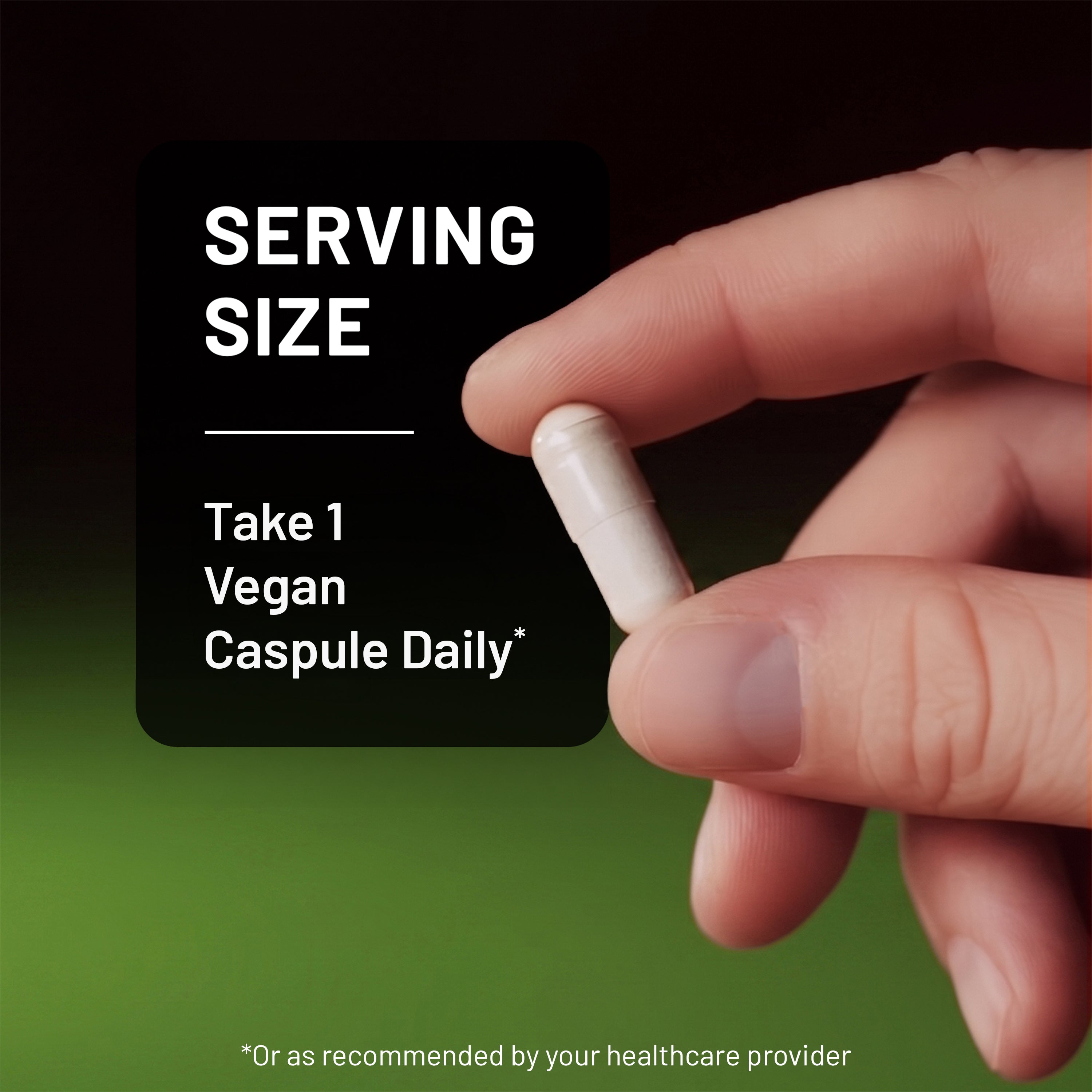 Hand holding a NatureWise DIM vegan capsule with serving size instructions on a green background