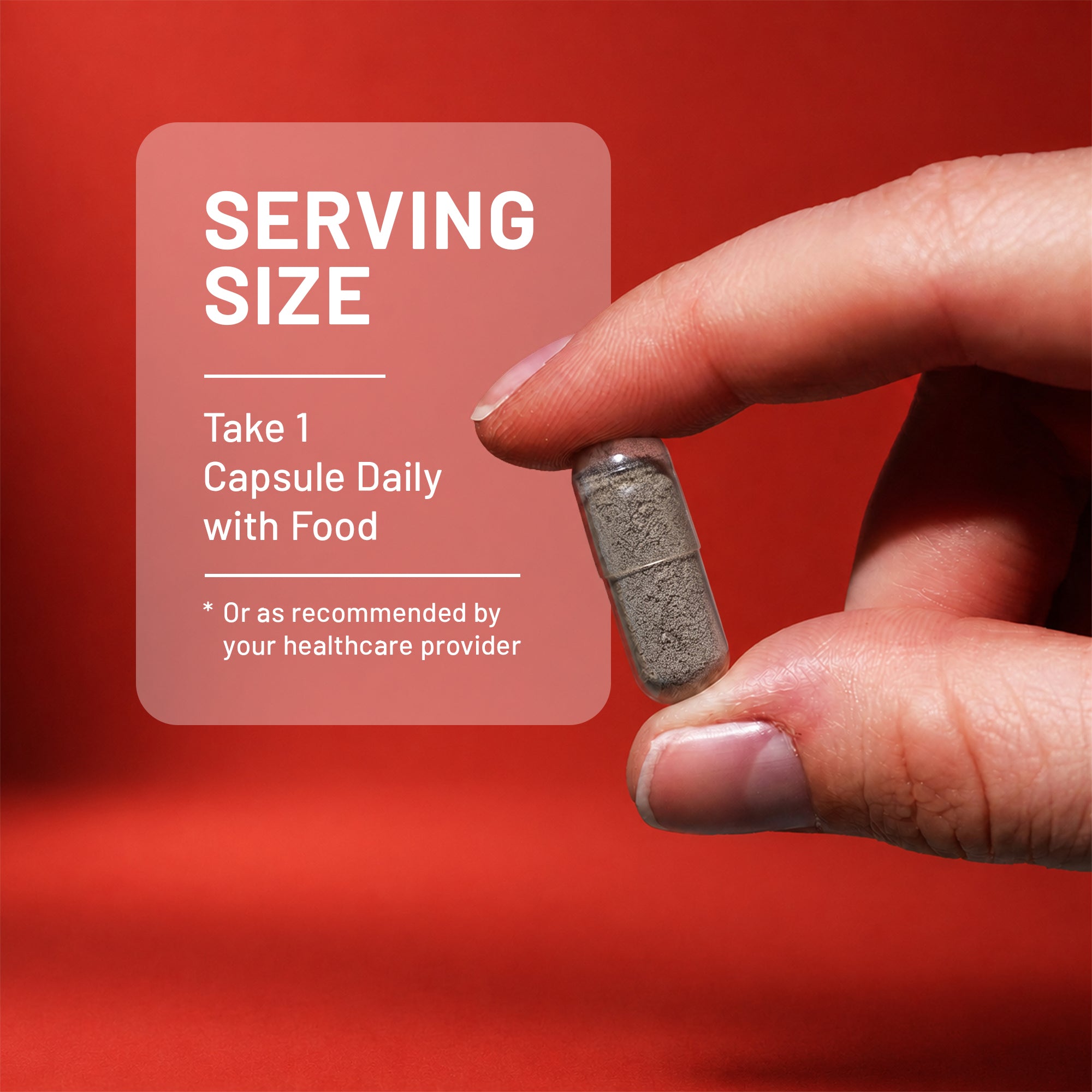 A hand holding a gray capsule pill against a red background, with a semi-transparent text box on the left reading 'SERVING SIZE' and 'Take 1 Capsule Daily with Food'.