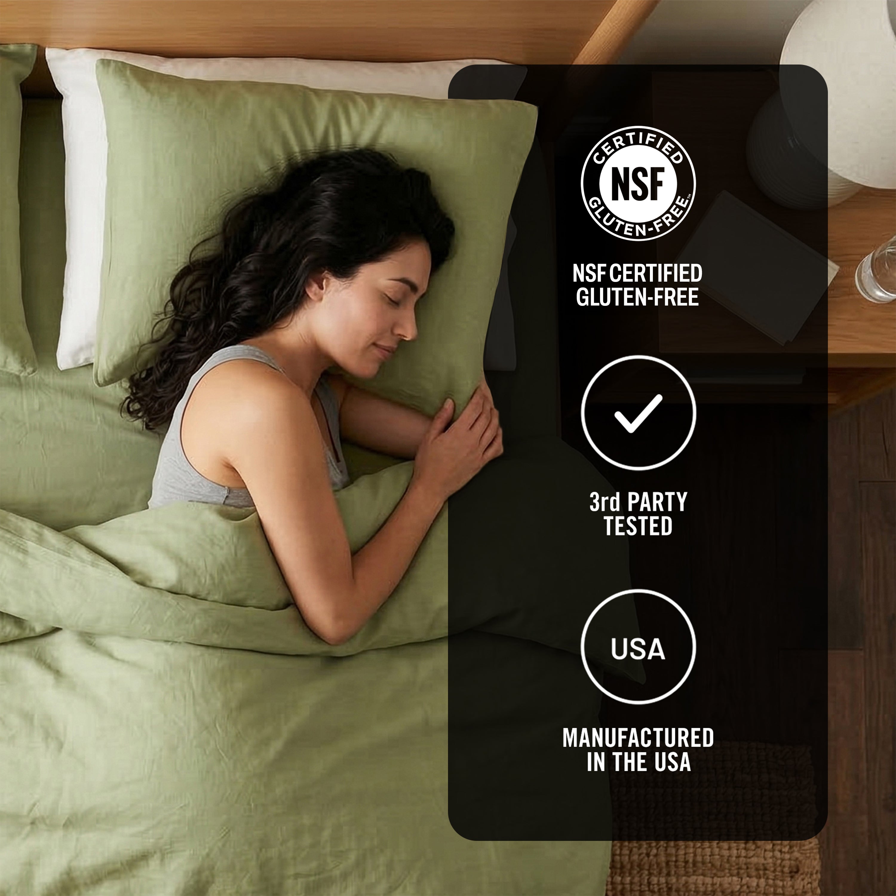 Woman sleeping under green bedding with NSF certification label in the corner