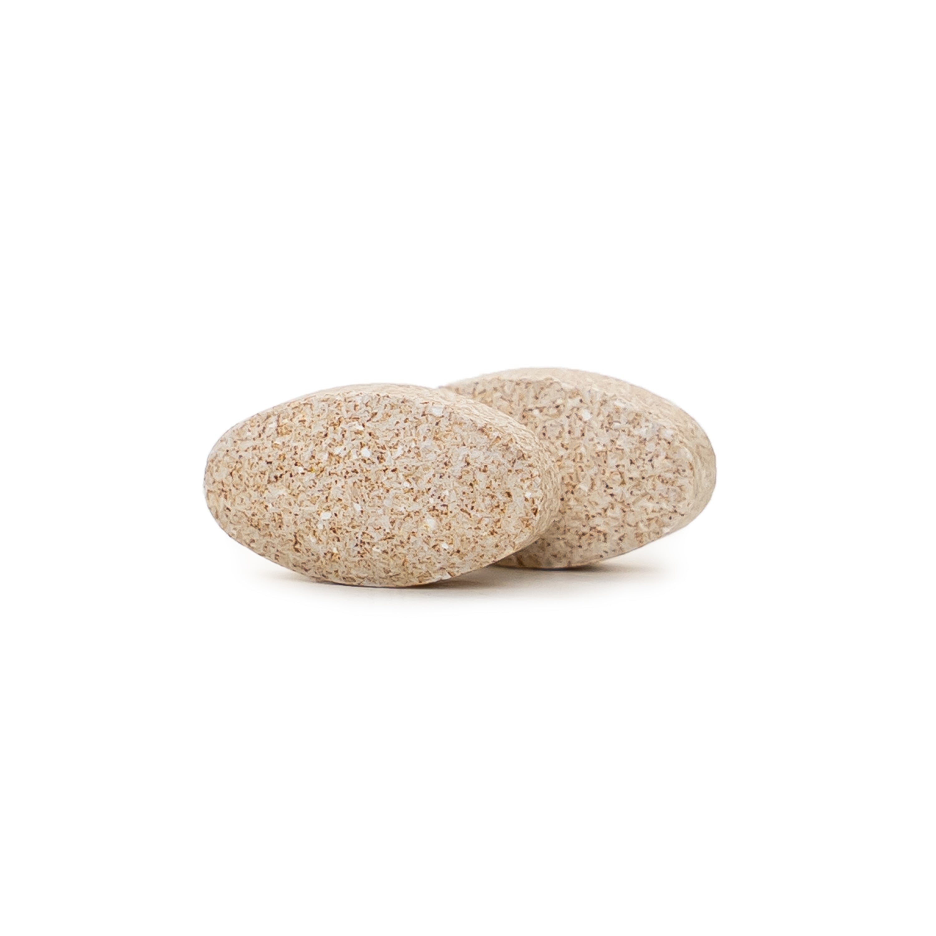 Two beige NatureWise Magnesium with Ashwagandha tablets on a white background
