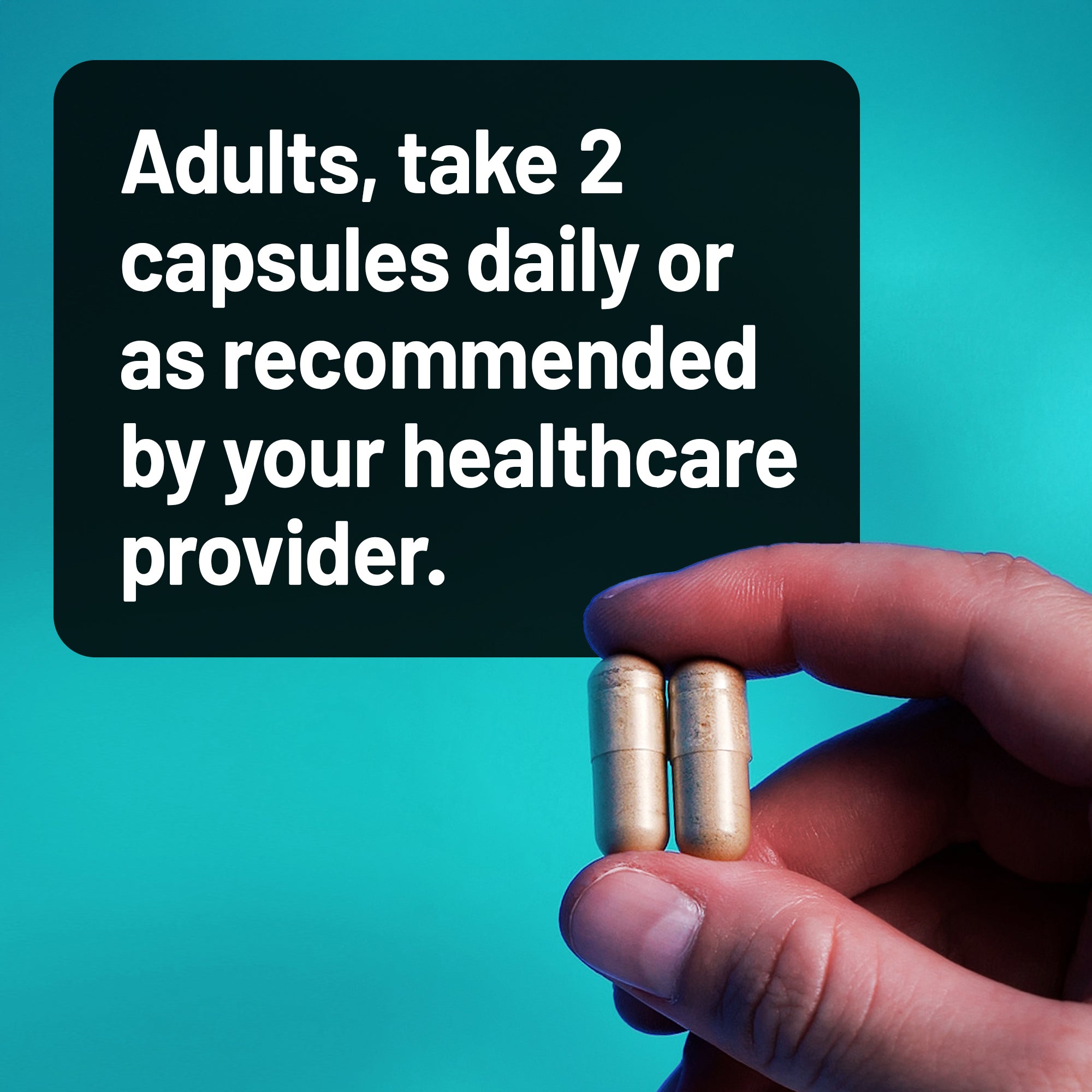 Hand holding two capsules with text about daily dosing on a teal background