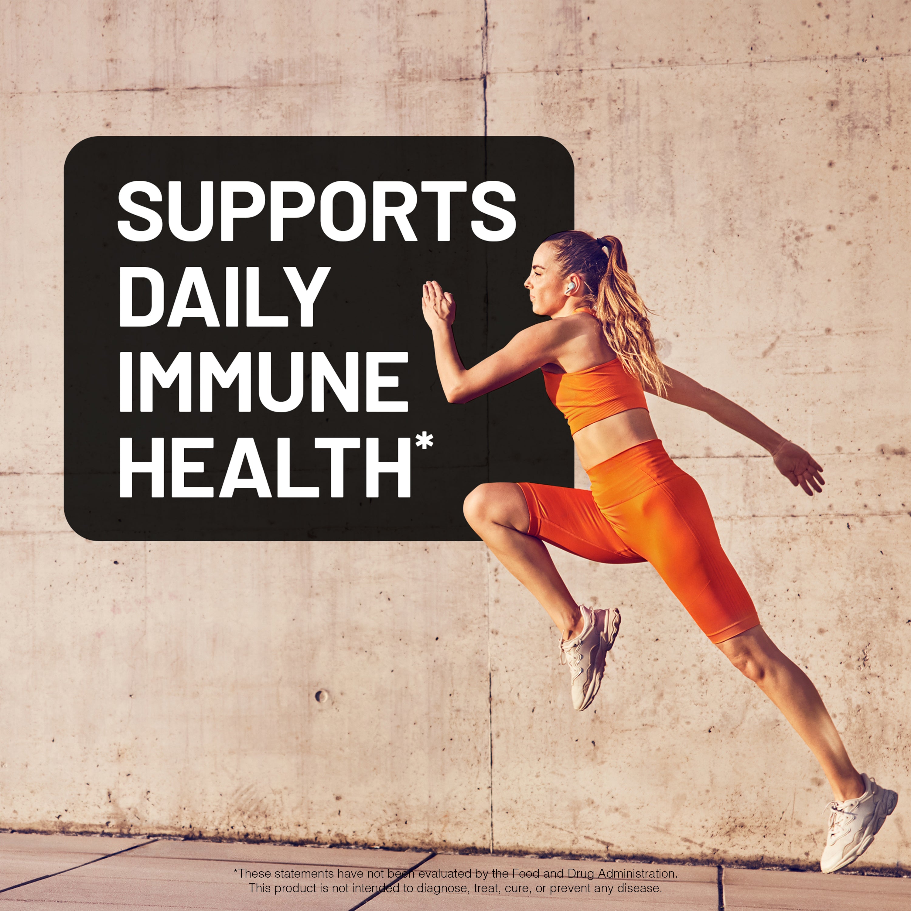 Woman in orange athletic wear running against a concrete wall with text about immune health.