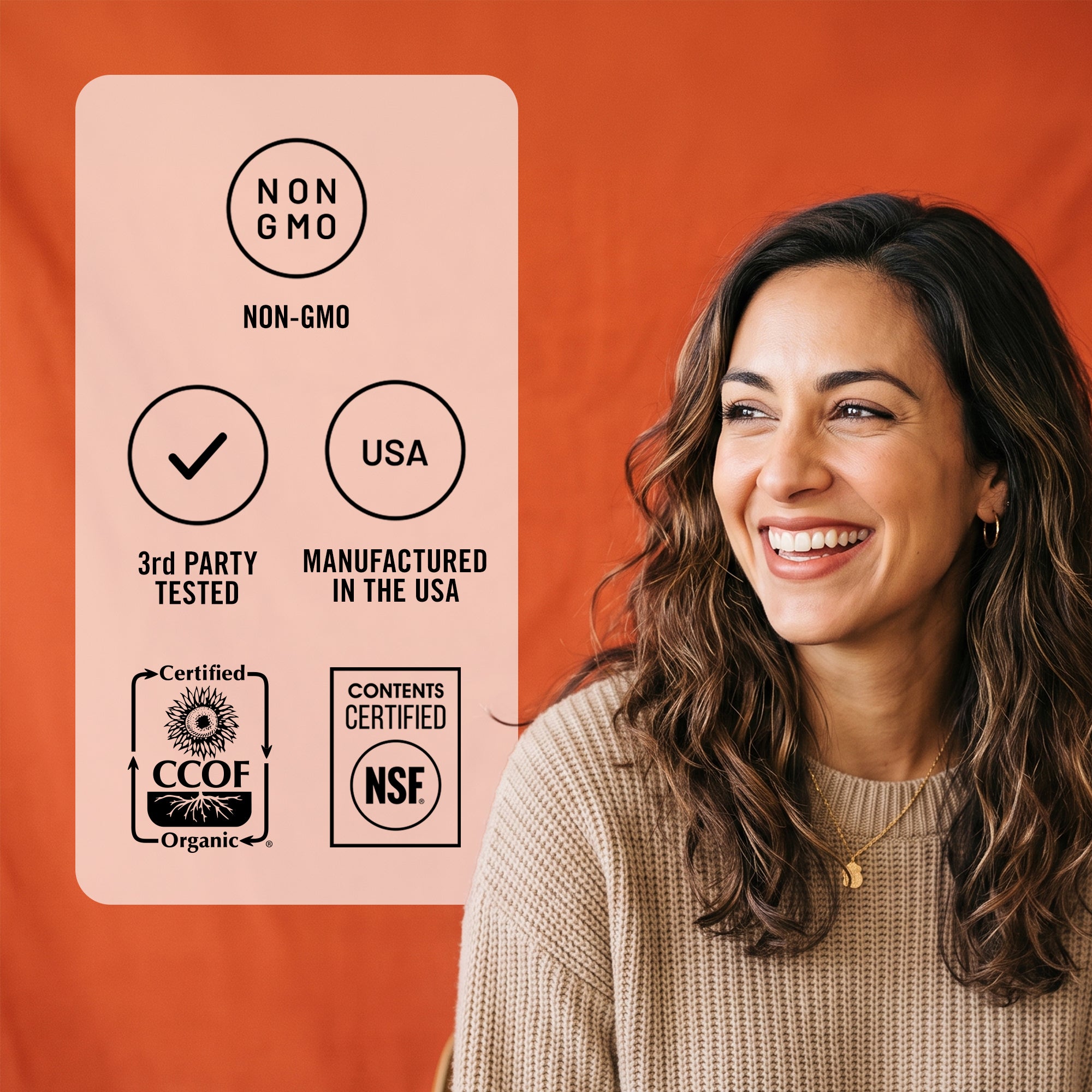 A smiling woman with long wavy brown hair is shown against a warm orange background, next to a pale pink informational card with black text reading 'NON GMO,' 'USA,' '3rd PARTY TESTED,' 'MANUFACTURED IN THE USA,' 'CCOF Organic,' and 'NSF.'.