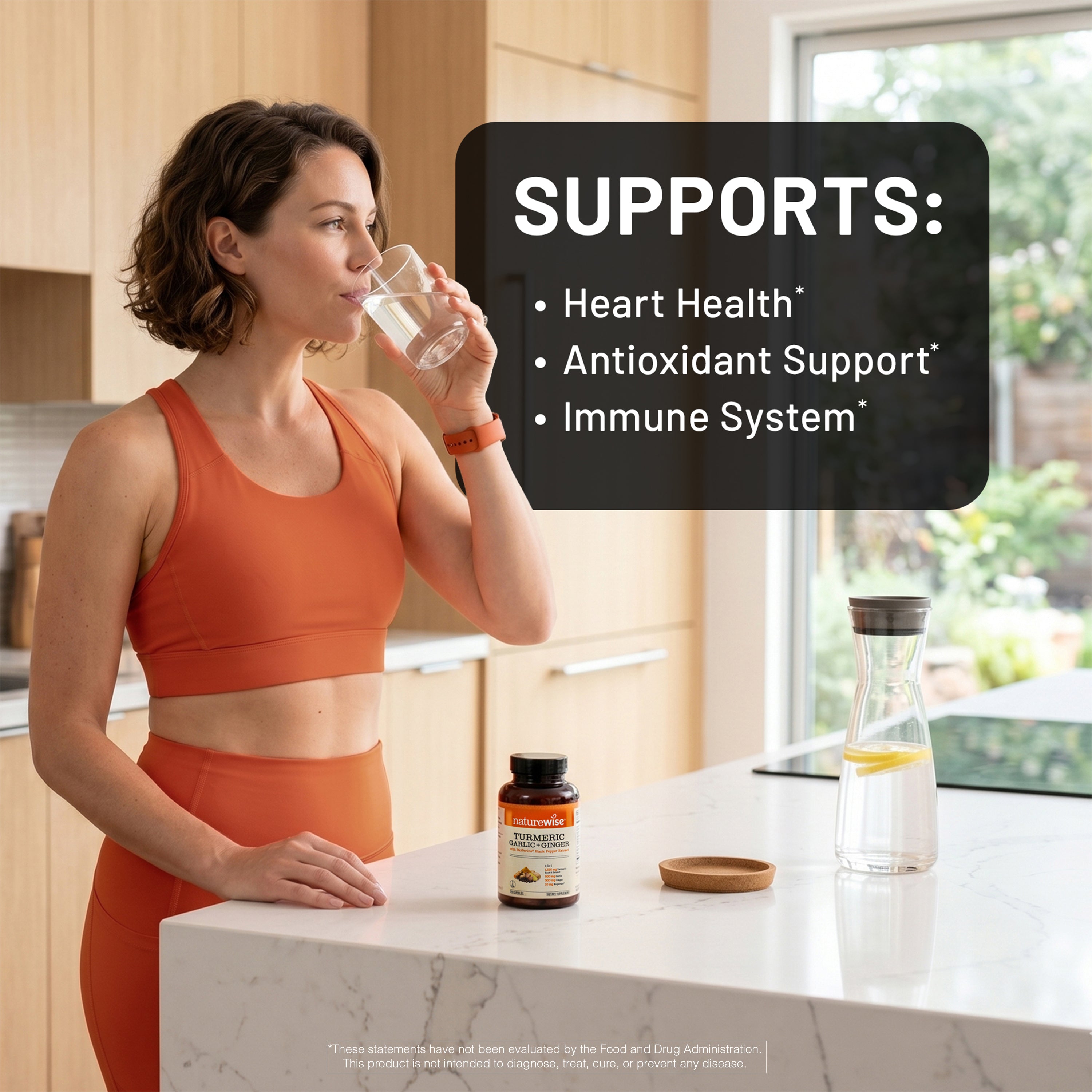 Woman in orange athletic wear drinking water in a kitchen with Turmeric Garlic Ginger health benefits text overlay