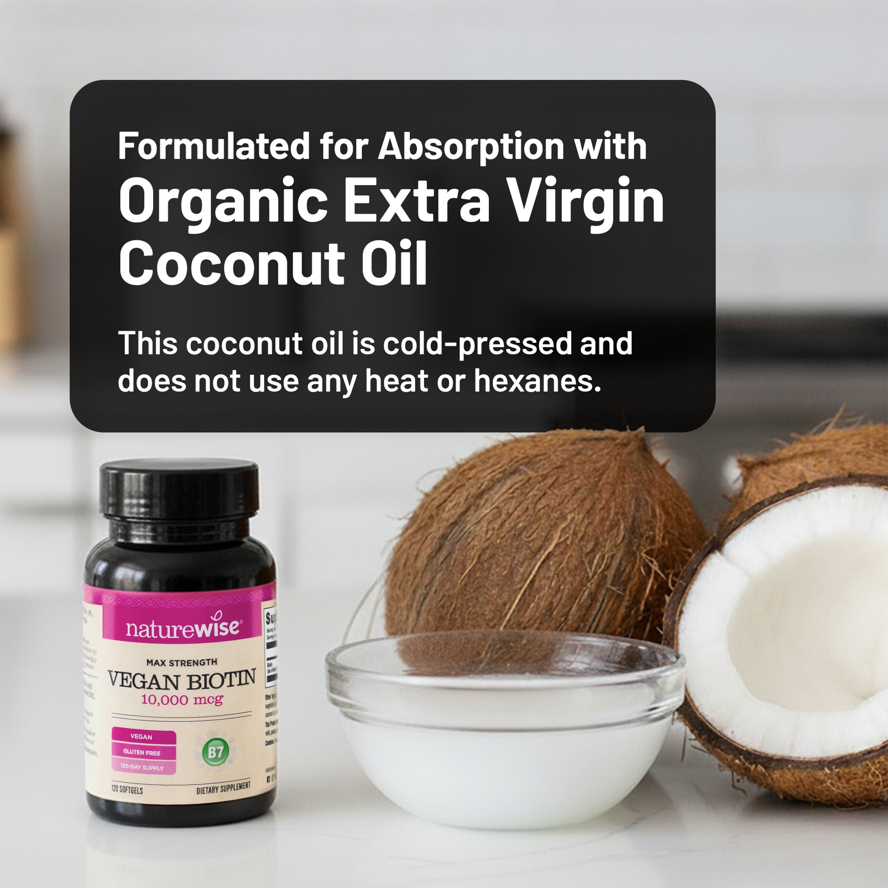 Naturewise vegan biotin 10,000 mcg supplement bottle with organic extra virgin coconut oil in a bowl on a white surface.