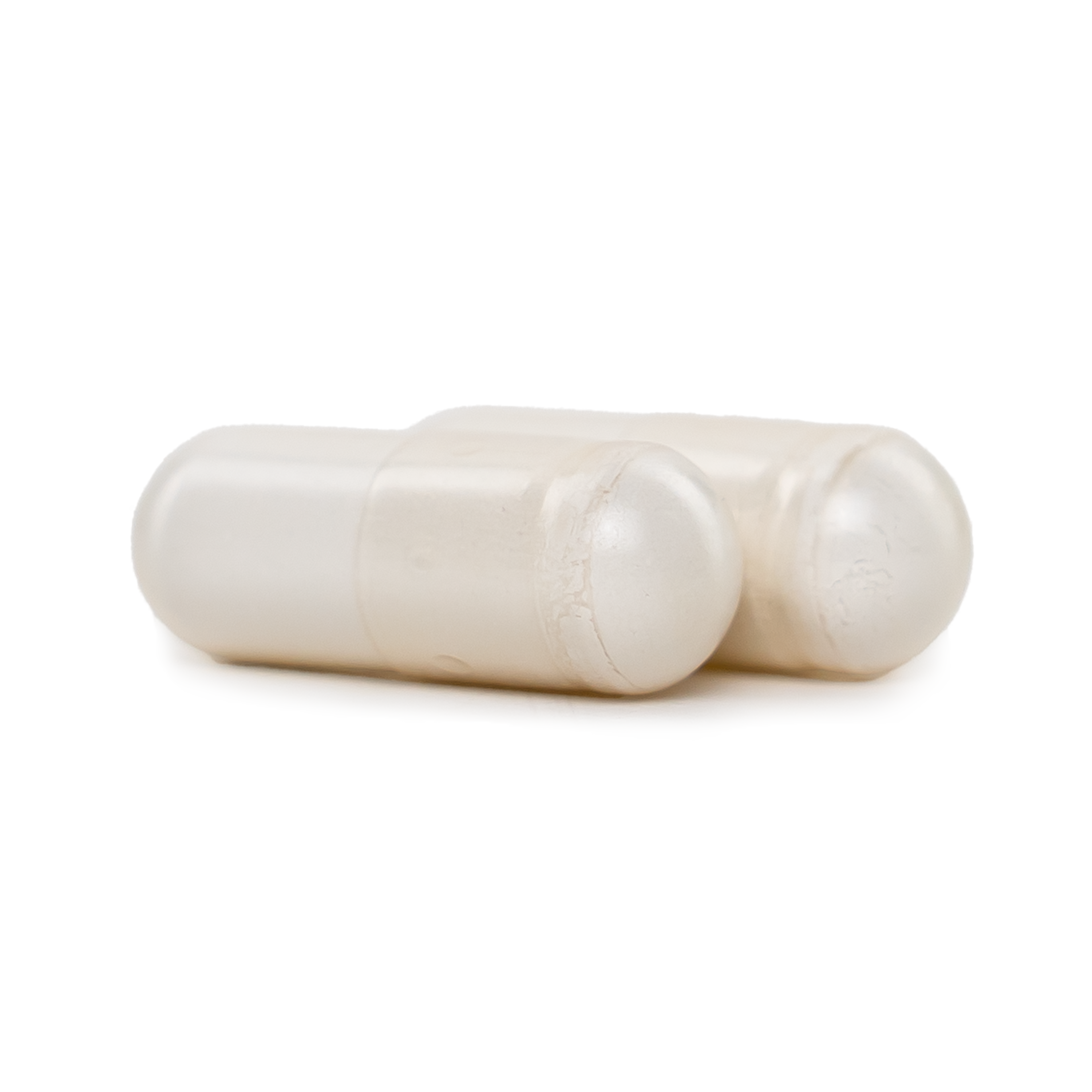 Two white algae calcium plus capsules on a blank background