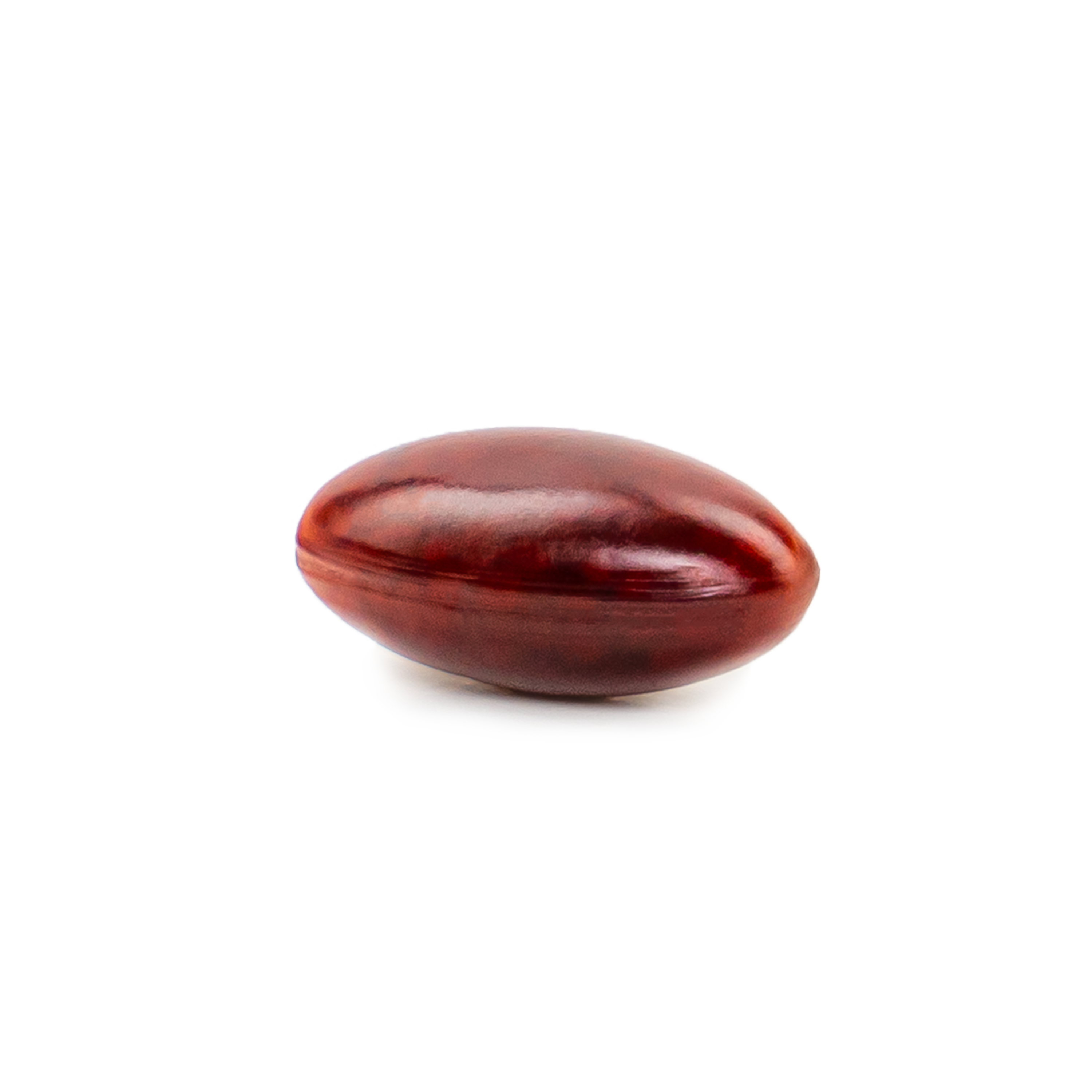 Astaxanthin supplement softgel on a plain background.