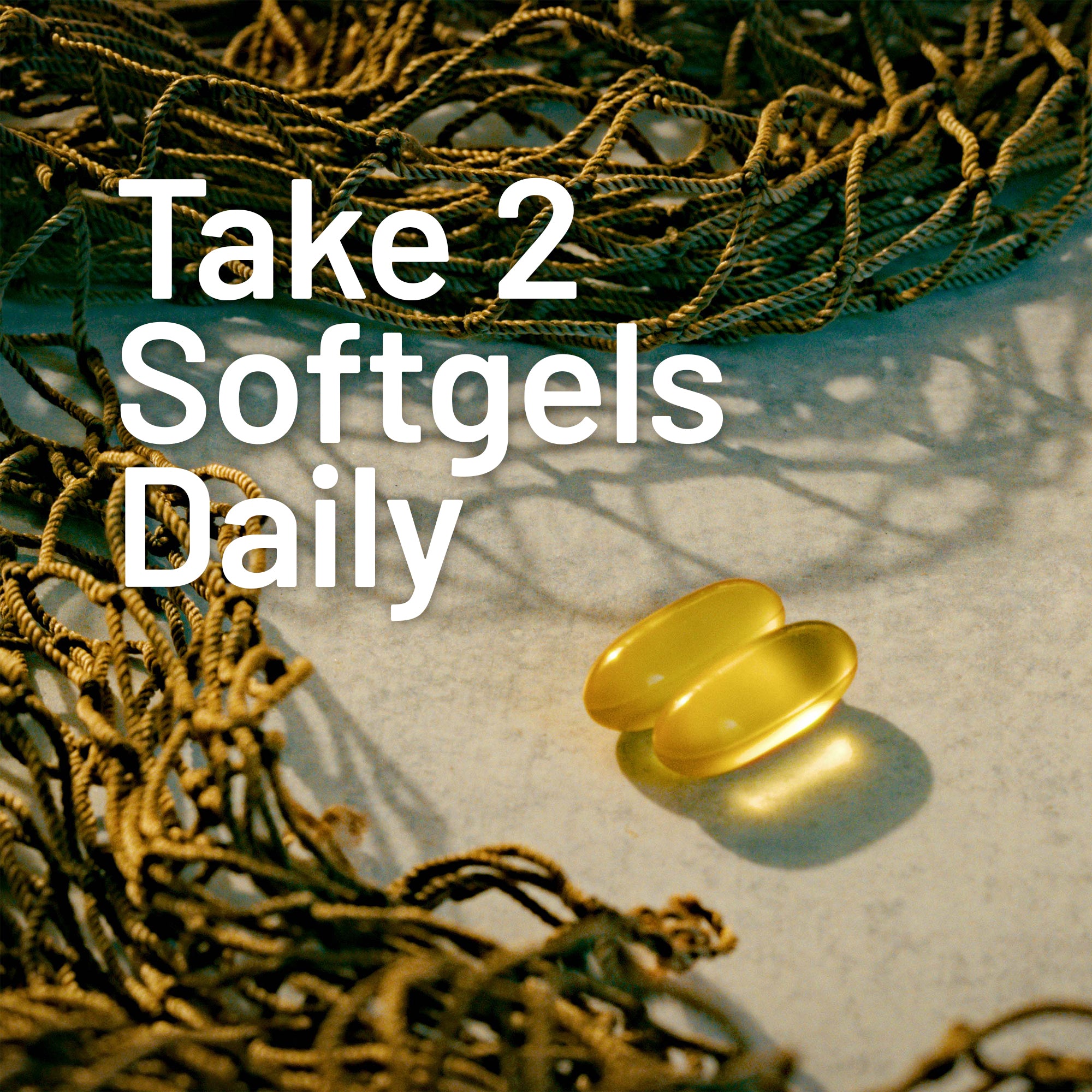 Two yellow softgels on a textured surface with fishing netting.