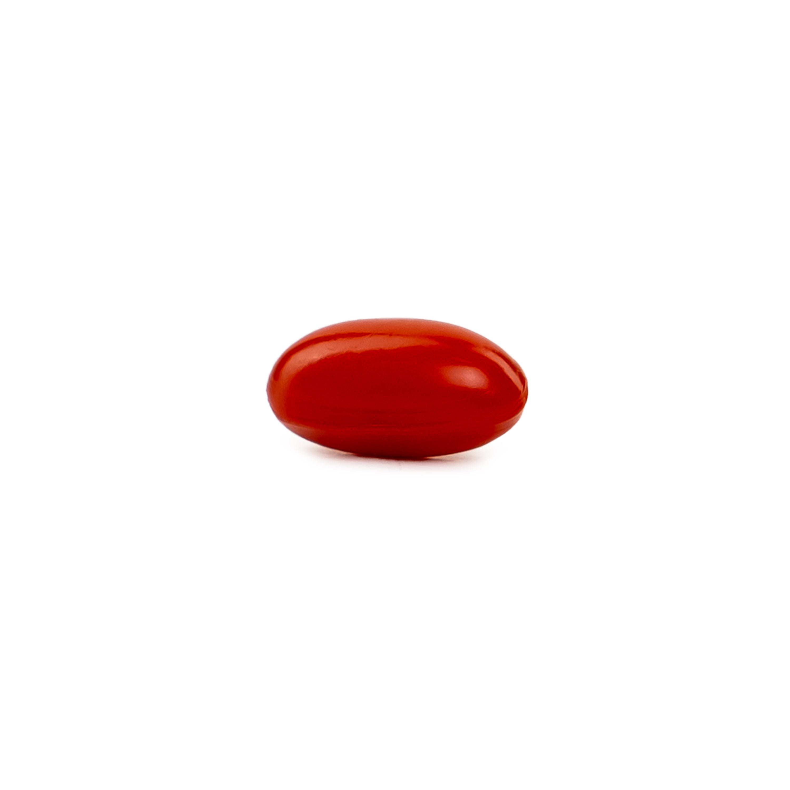 A single smooth, glossy red oval object, resembling a small polished stone or bead, centered on a solid white background.
