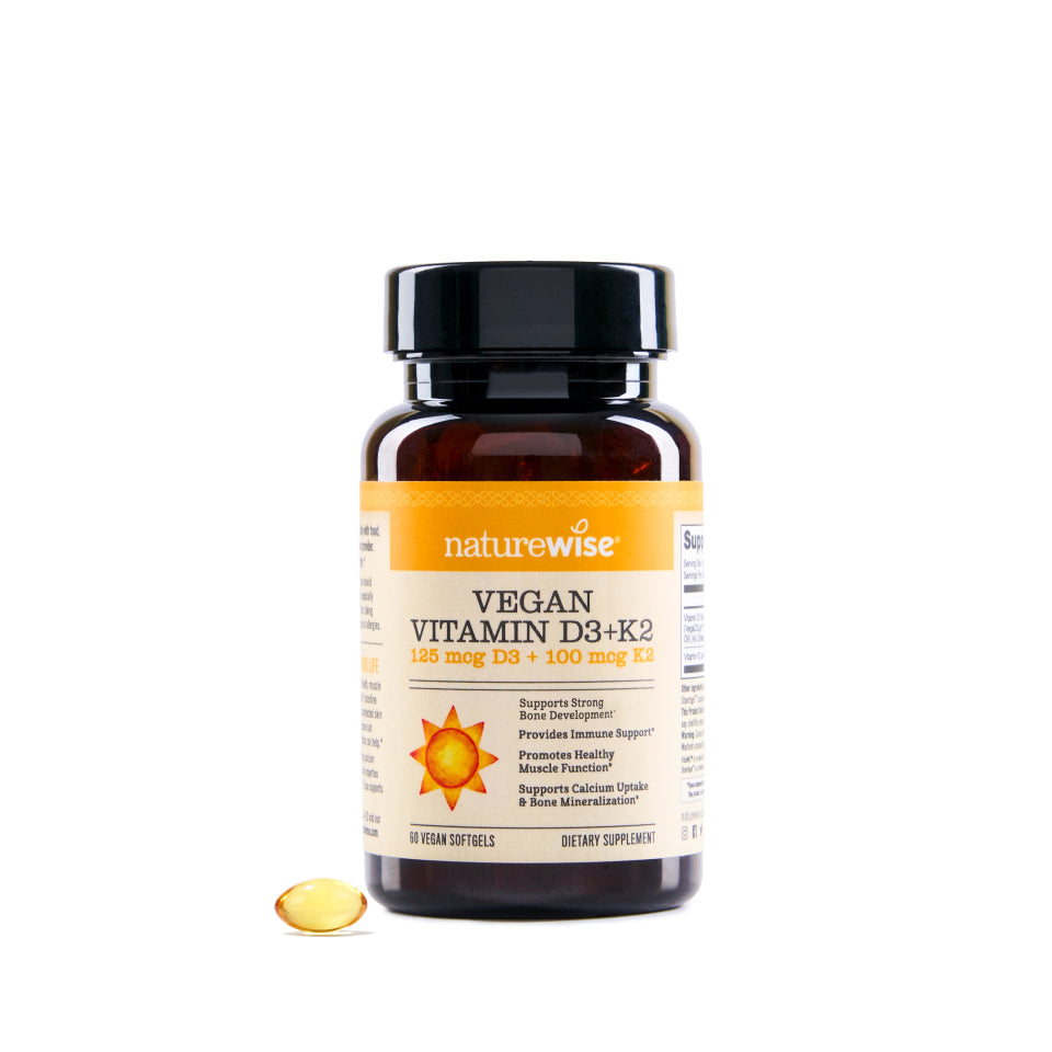 NatureWise Vegan Vitamin D3+K2 supplement bottle with a pill on a white background