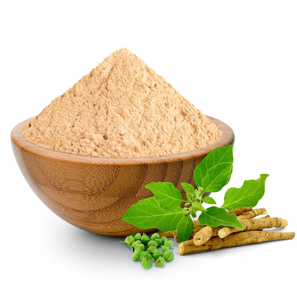 Wooden bowl filled with brown Ashwagandha powder, ashwagandha green leaves, and ashwagandha sticks on a white background